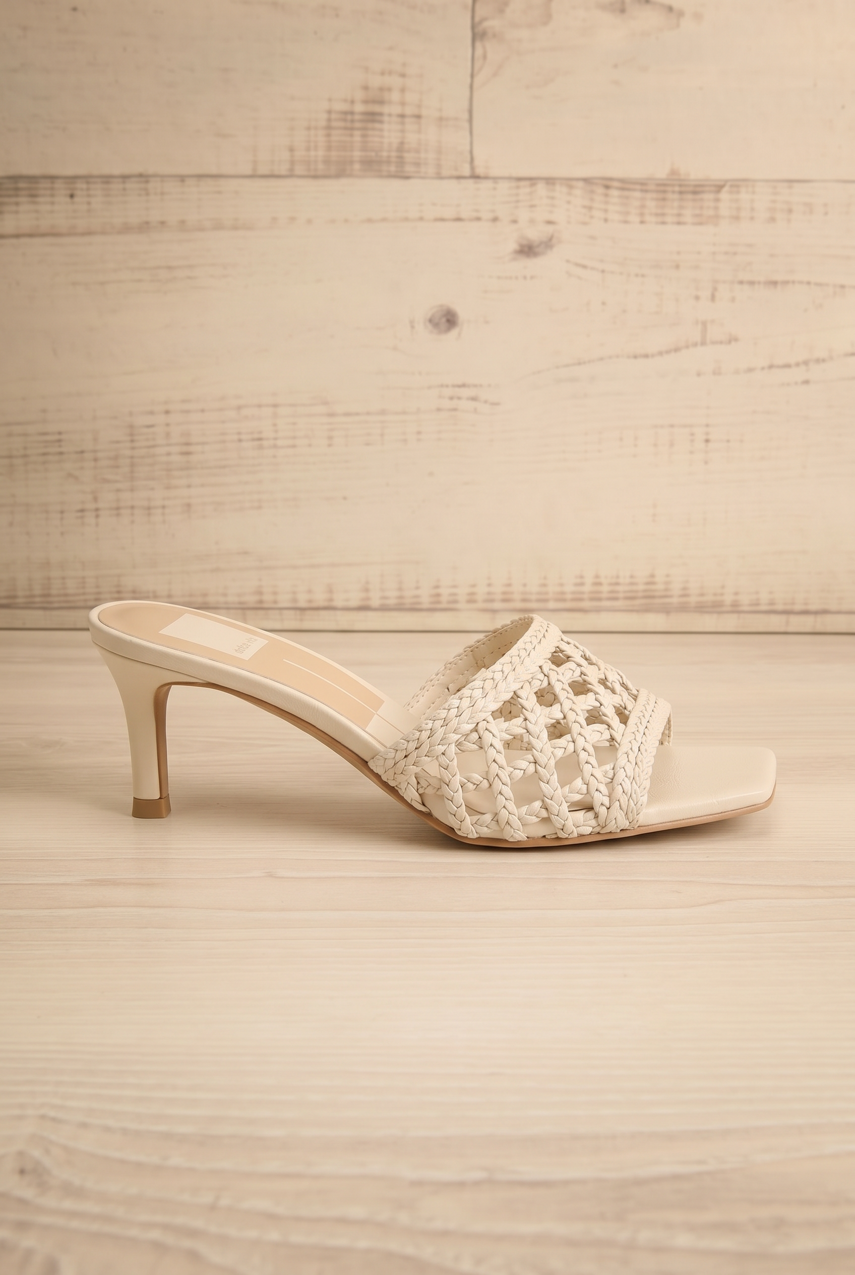 sideview of Dolce Vita Boween Ivory Braided Faux Leather Kitten Heel Mules from la petite garçonne.