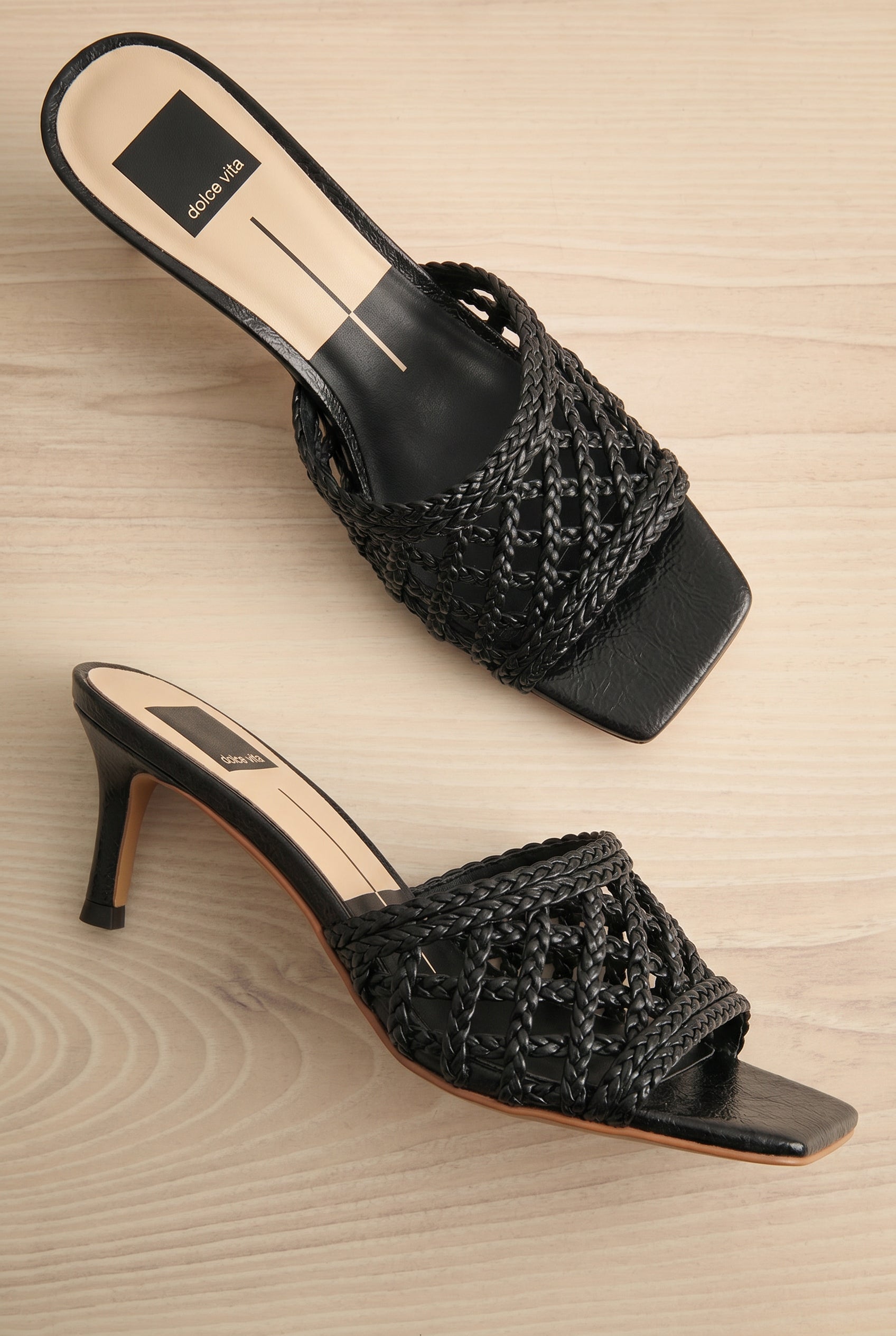 Pair of Dolce Vita Boween black Braided Faux Leather Kitten Heel Mules from la petite garçonne.