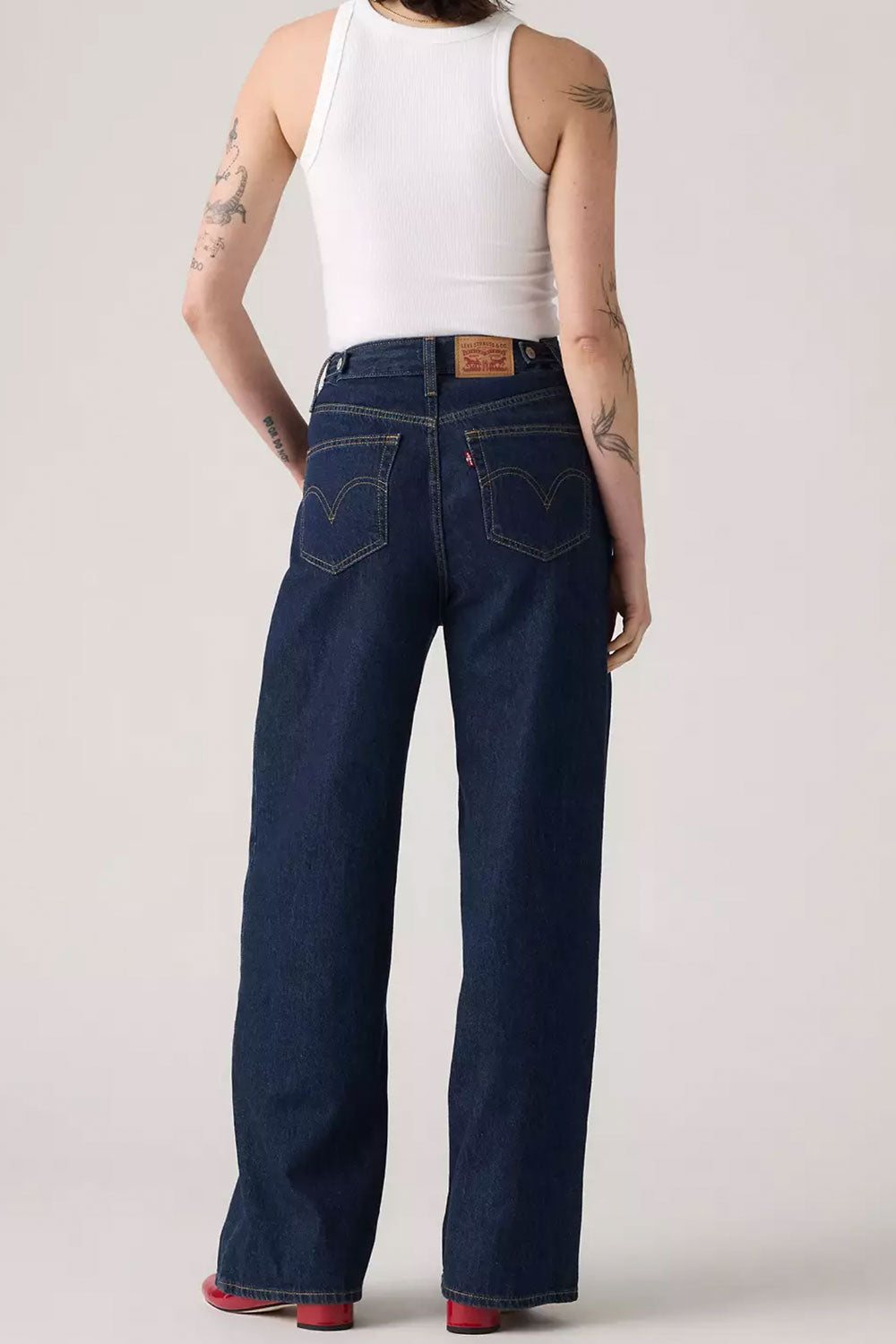 Person wearing Braga Dark Wash High-Waisted back from La petite garçonne