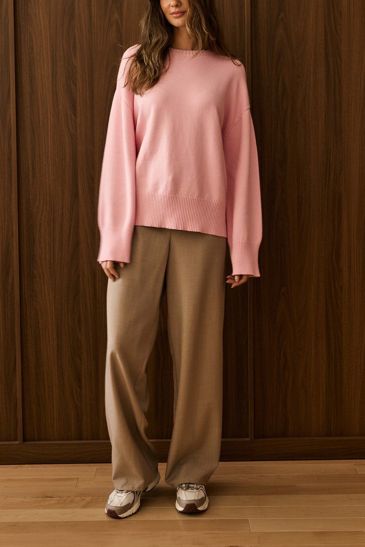 view of a woman wearing Dailystory Brooke Pink Boxy Knit Sweater with Mock Neck at La petite garçonne