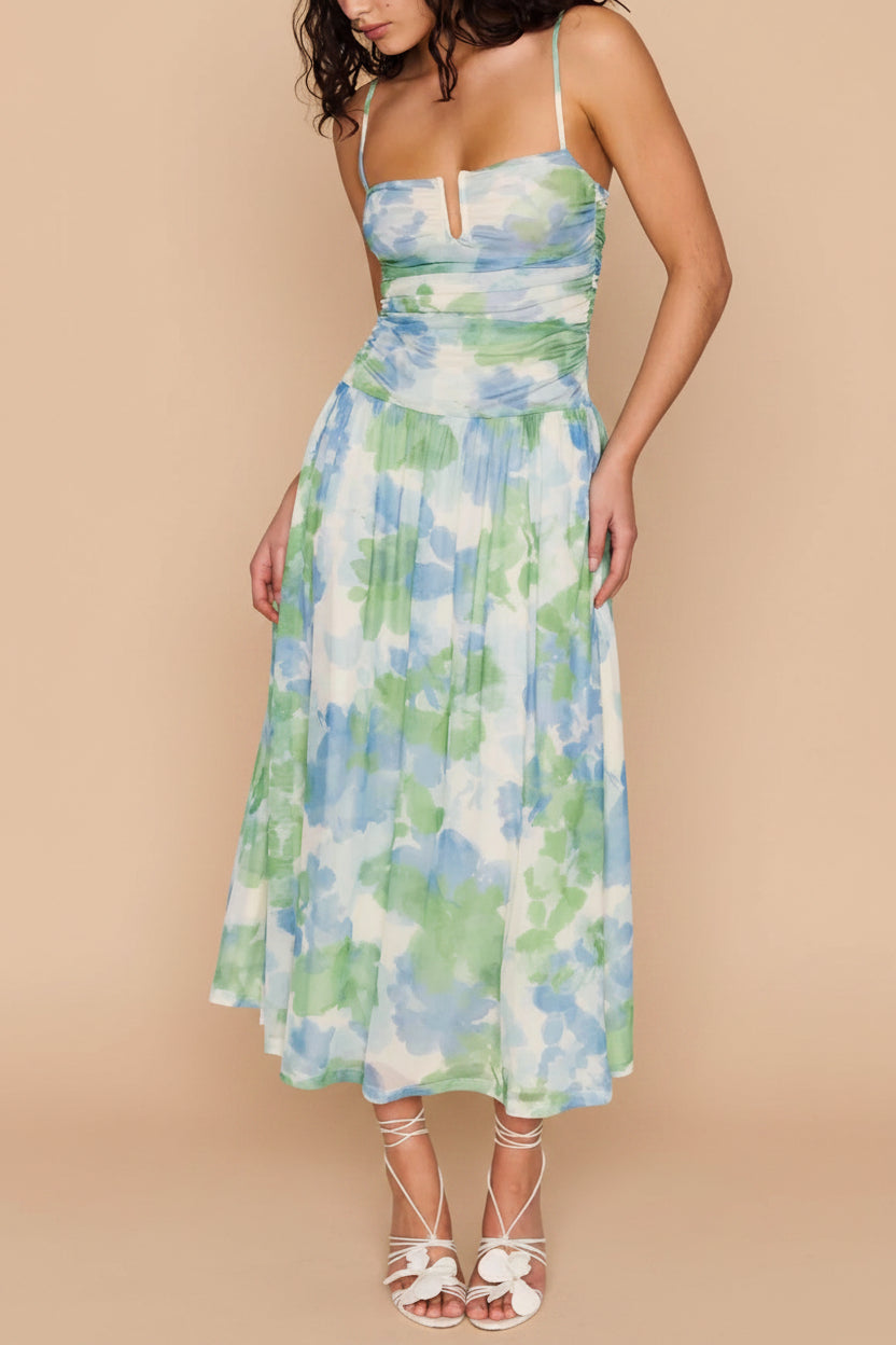 view of a woman wearing Carrye Drop-Waist Floral Midi Dress from Boutique 1861