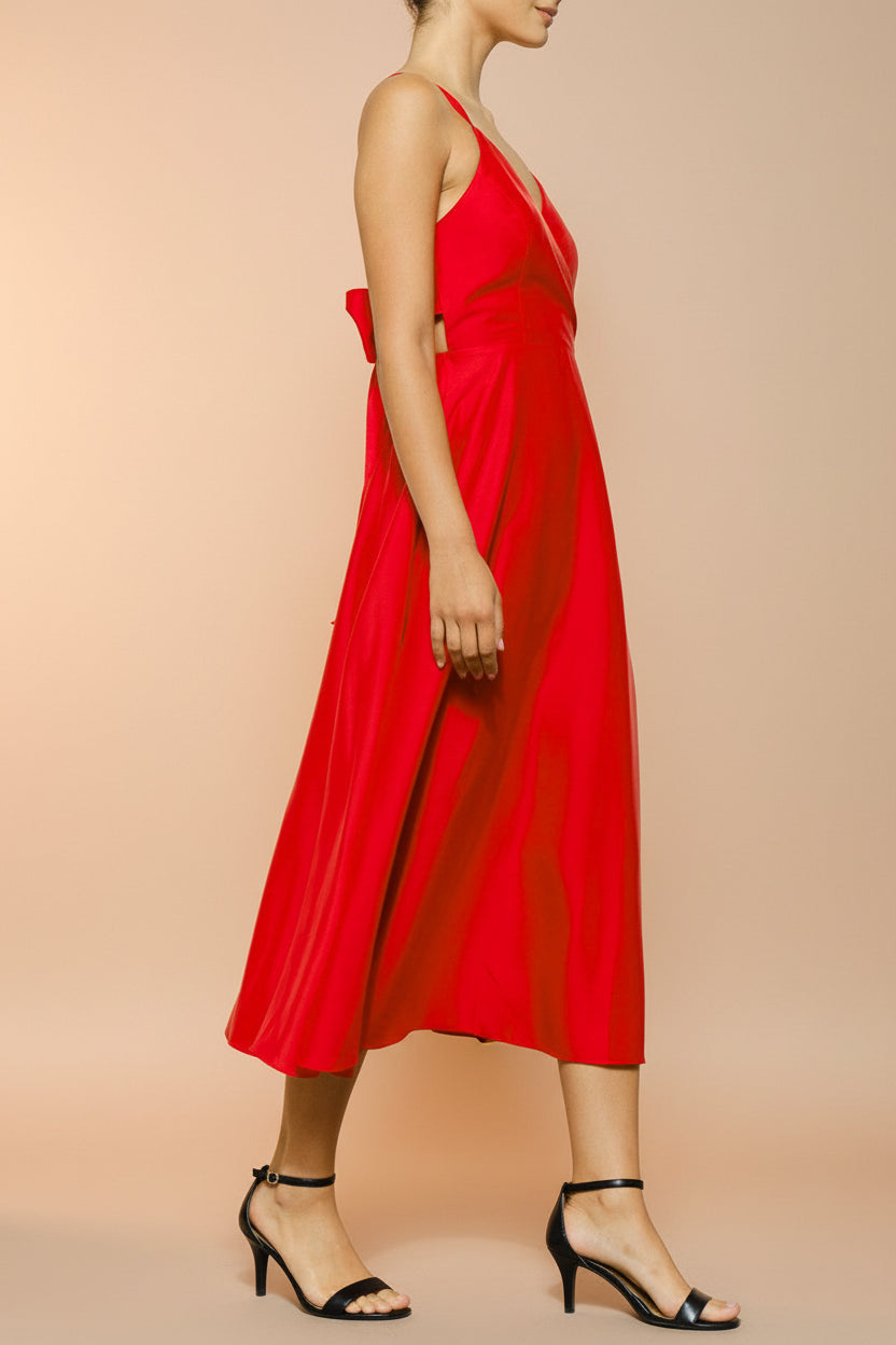 side view of a woman wearing Caryanne Red Tie-Back Satin Dress from Boutique 1861