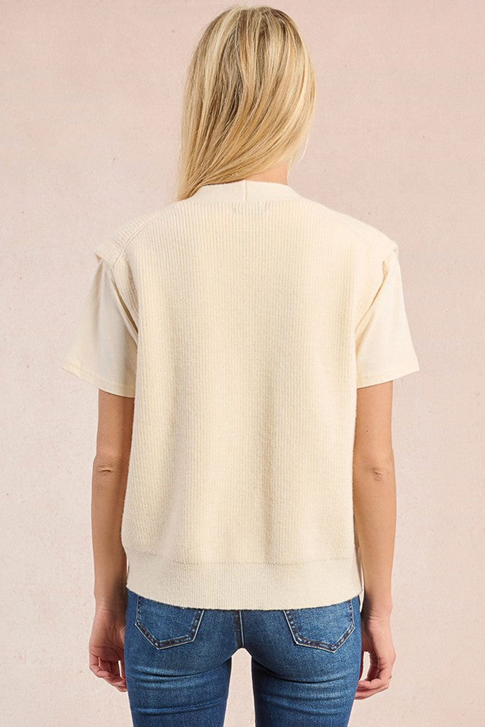 Woman wearing Castelo Ivory Sleeveless Knit Vest from La petite garçonne back view