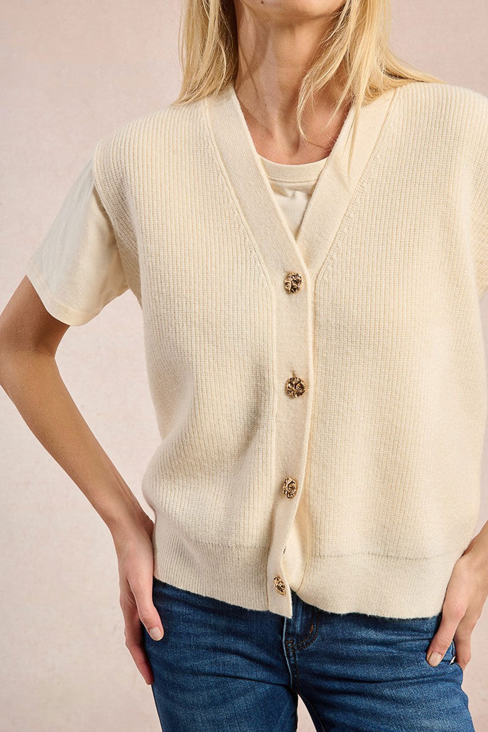 Woman wearing Castelo Ivory Sleeveless Knit Vest from La petite garçonne close up 