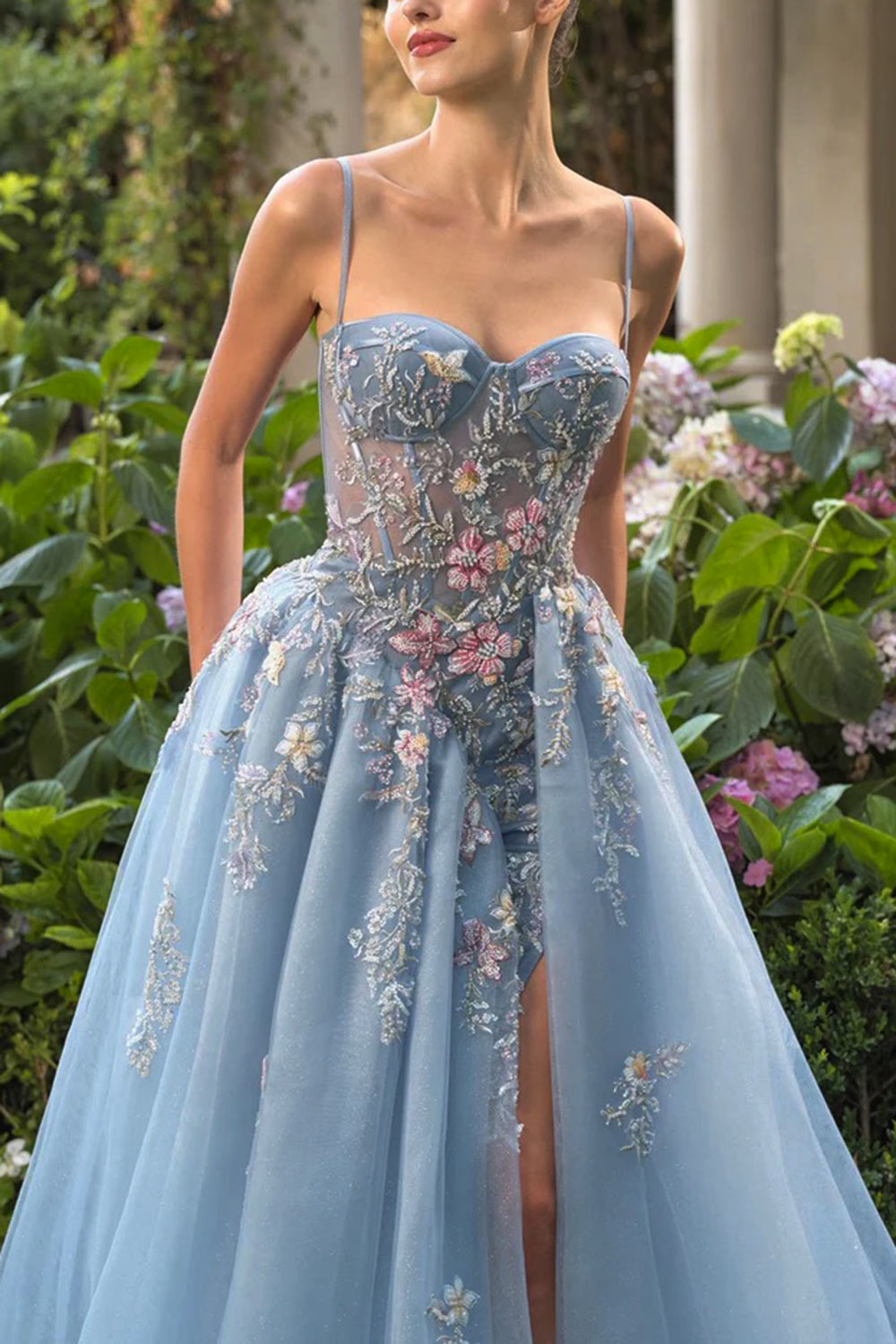 close-up of a woman wearing Cecily Crystal Embroidered Blue Ball Gown Dress from Boutique 1861