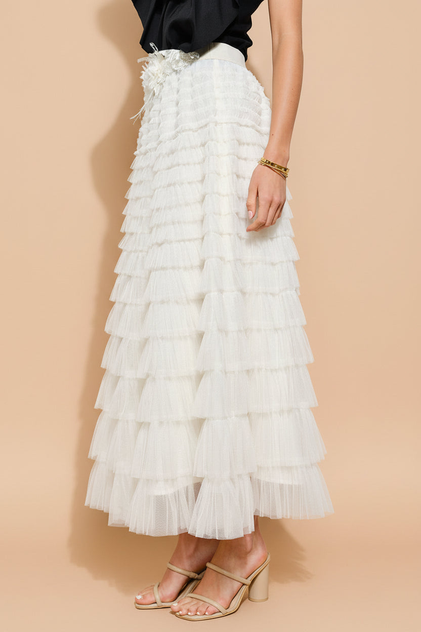 side view of a woman wearing Christabel Ivory Ruffled Maxi Skirt with 3D Flowers from Boutique 1861