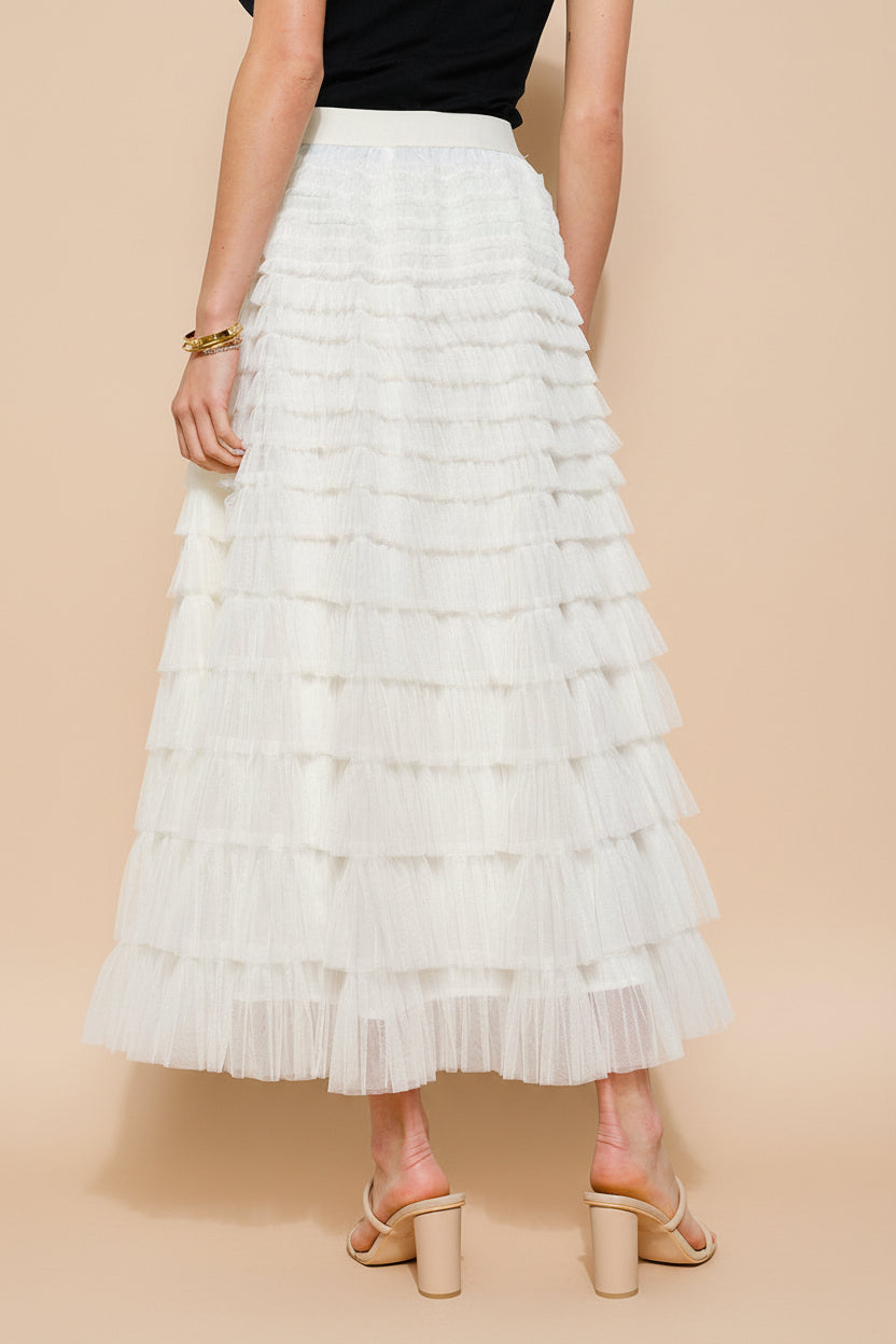 back view of a woman wearing Christabel Ivory Ruffled Maxi Skirt with 3D Flowers from Boutique 1861