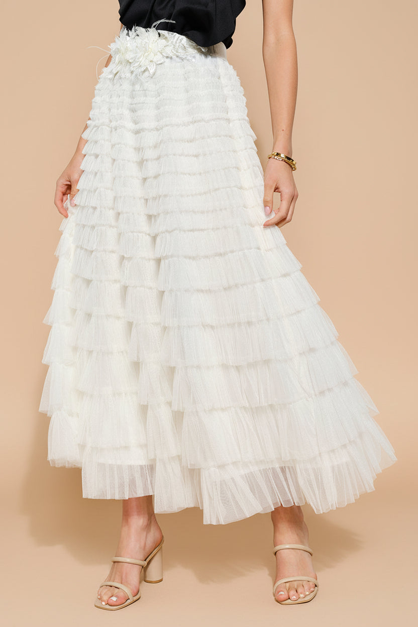 a woman in mouvement wearing Christabel Ivory Ruffled Maxi Skirt with 3D Flowers from Boutique 1861