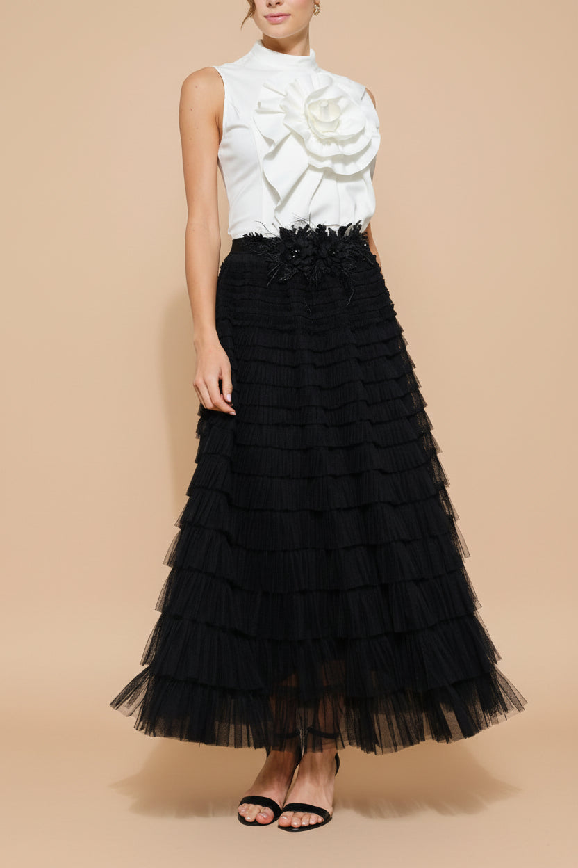 front view of a woman wearing Christabel Black Ruffled Maxi Skirt with 3D Flowers from Boutique 1861