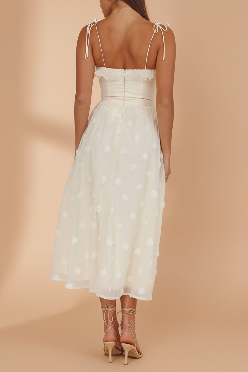 back of a woman wearing Claribel Cream Midi Dress with Floral-Embellishment from Boutique 1861 