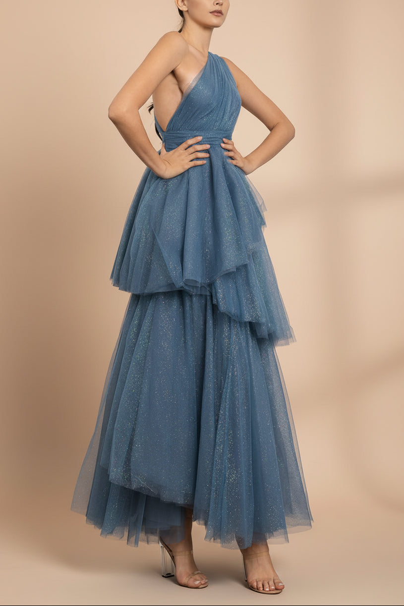 side of a woman wearing Cody Blue Grey Maxi One Shoulder Dress with Glitters fromt Boutique 1861