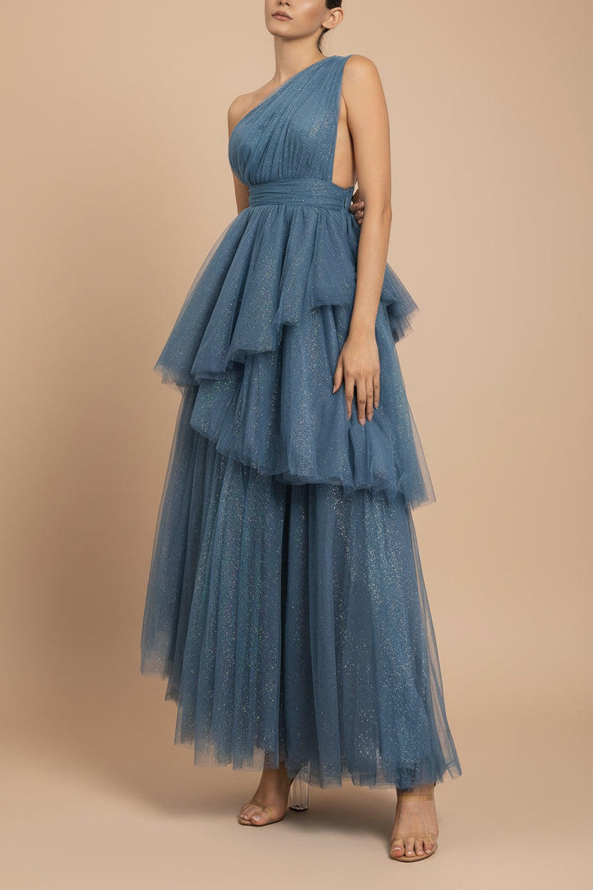 a woman wearing Cody Blue Grey Maxi One Shoulder Dress with Glitters fromt Boutique 1861