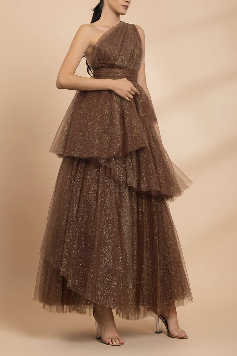 side of a woman wearing Cody Brown Maxi One Shoulder Dress with Glitters from Boutique 1861 