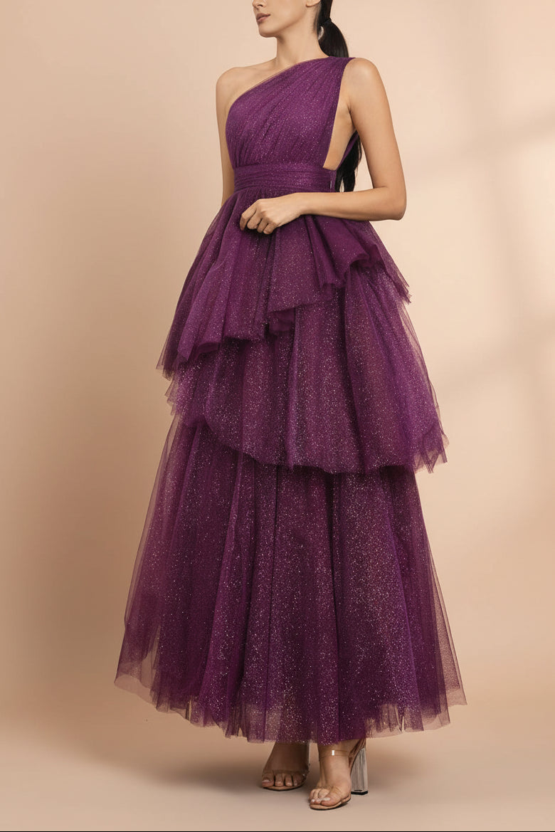 right side of a woman wearing Cody Purple Maxi One Shoulder Dress with Glitters from Boutique 1861