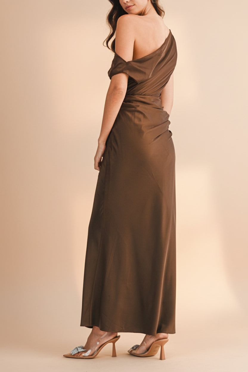 Back view of a woman wearing Colleen Brown Asymmetrical Satin Dress from boutique 1861
