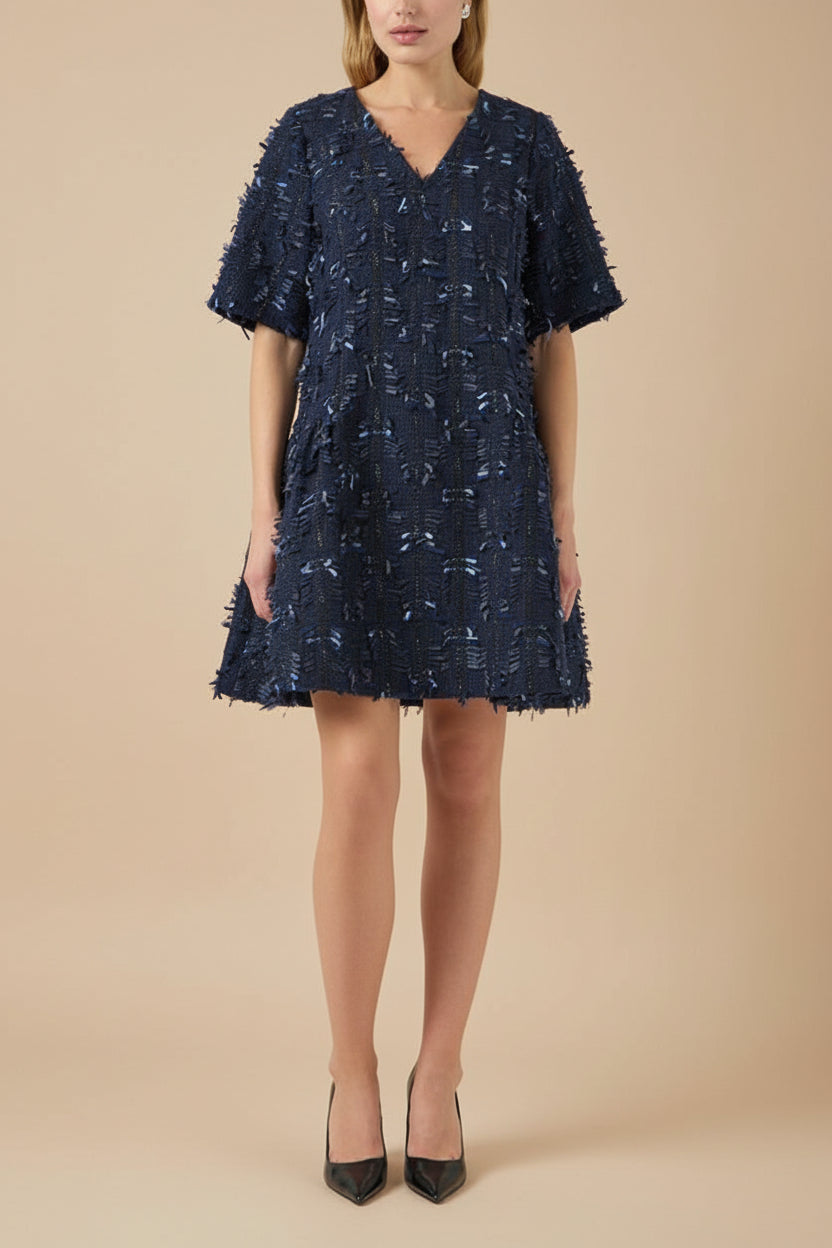 front view of a woman wearing Coralyne Navy Tweed V-Neck Mini Dress from Boutique 1861