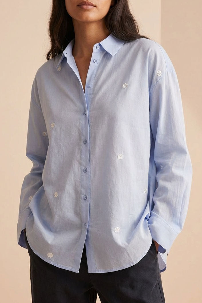 woman wearing the Catania Oversized Blue Shirt with Floral Embroidery from la petite garçonne