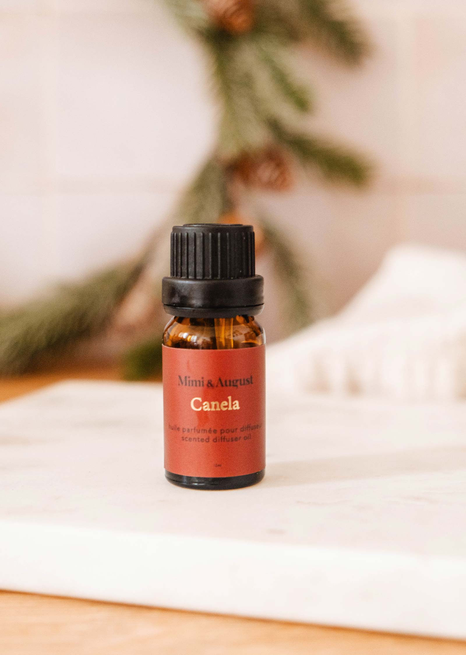 Canela Christmas Scented Oils bottle by Mimi and August.