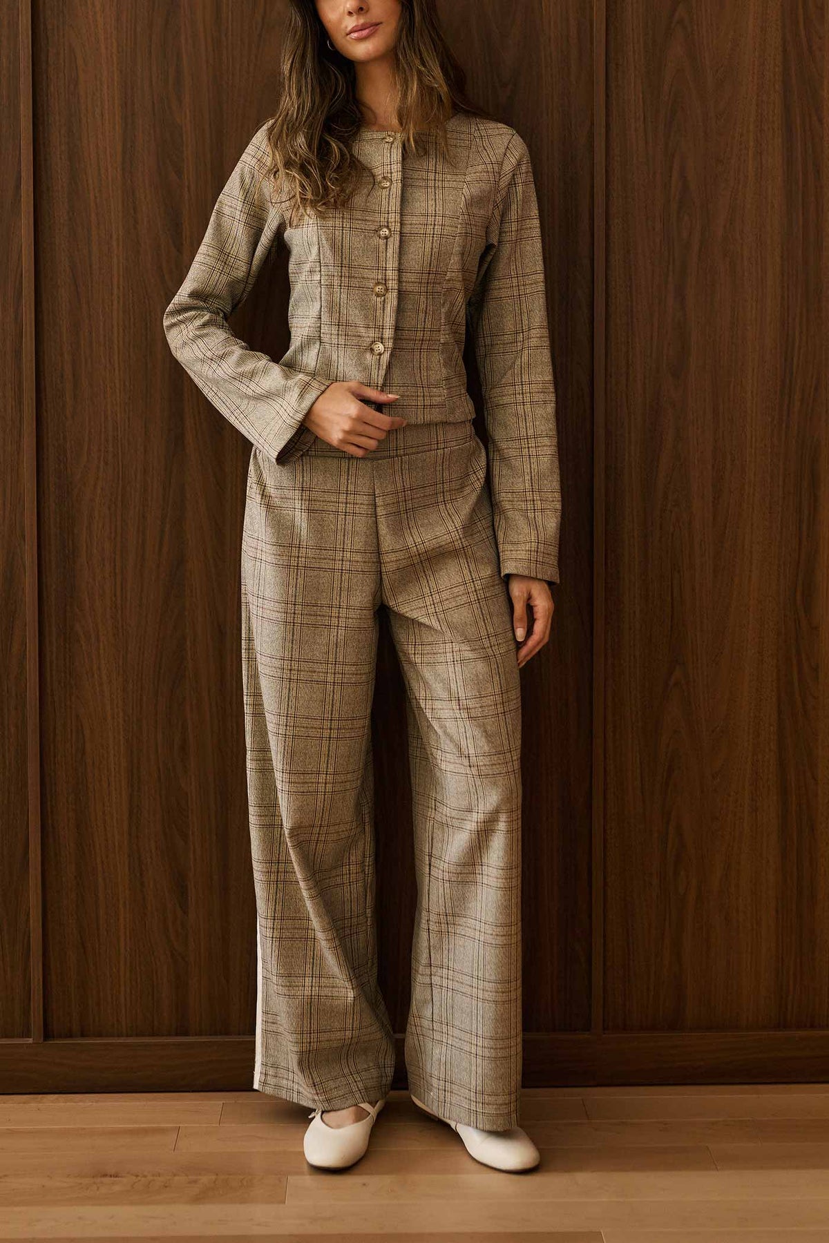 view of a woman wearing Dailystory Claudia Pants Brown Plaid Wide-Leg Pants at La petite garçonne