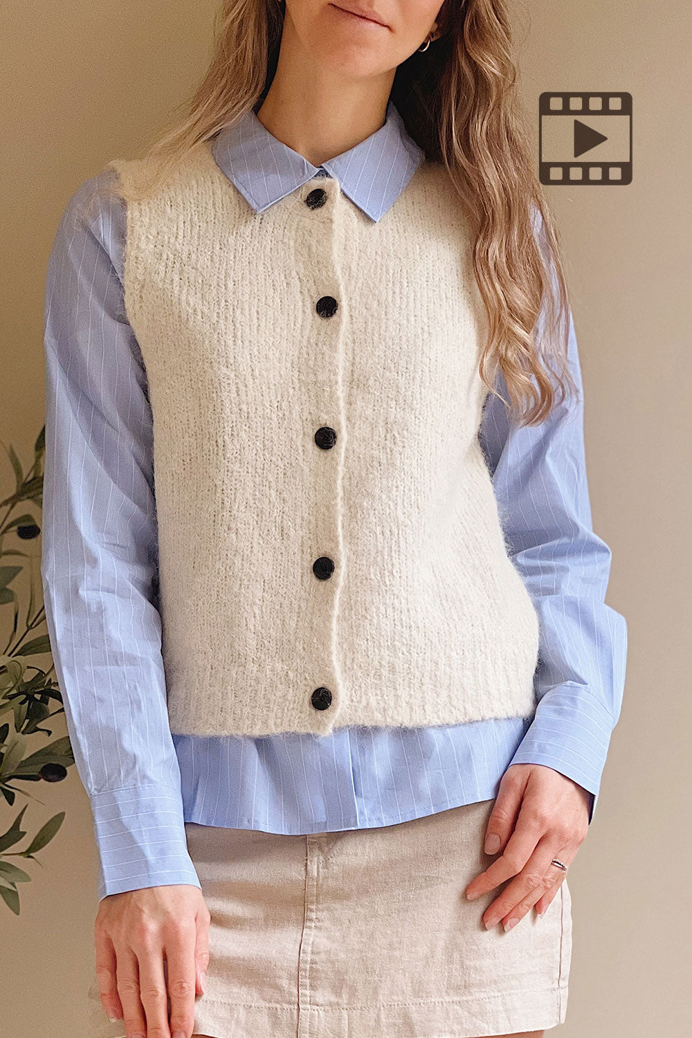 Woman wearing Cobar Ivory Fluffy Knitted Button-Up Vest from La petite garçonne 