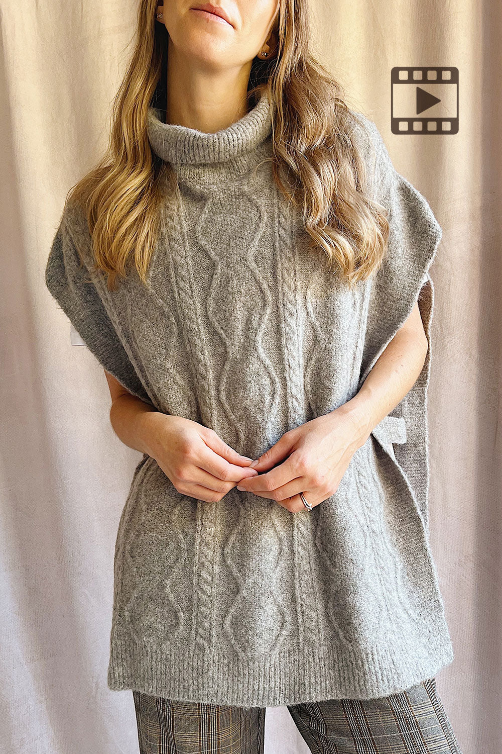 Photo of a model wearing Brehat Grey Knit Poncho from La petite garçonne 