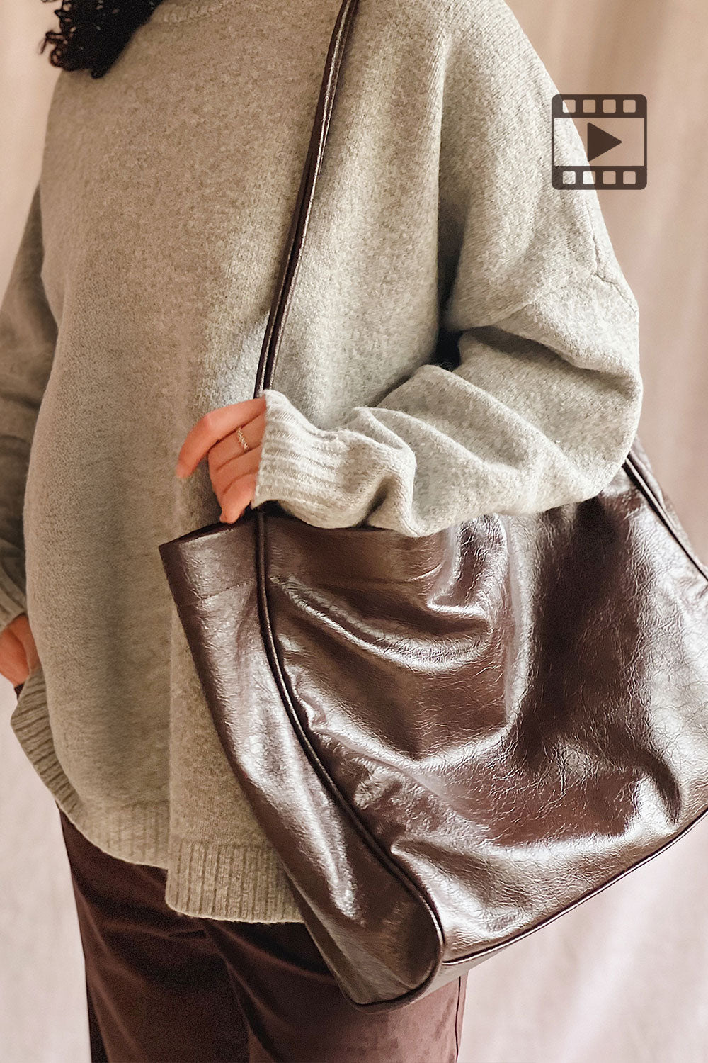 Woman holding a Joffrey Large Brown Faux Leather Tote Bag from La petite garçonne