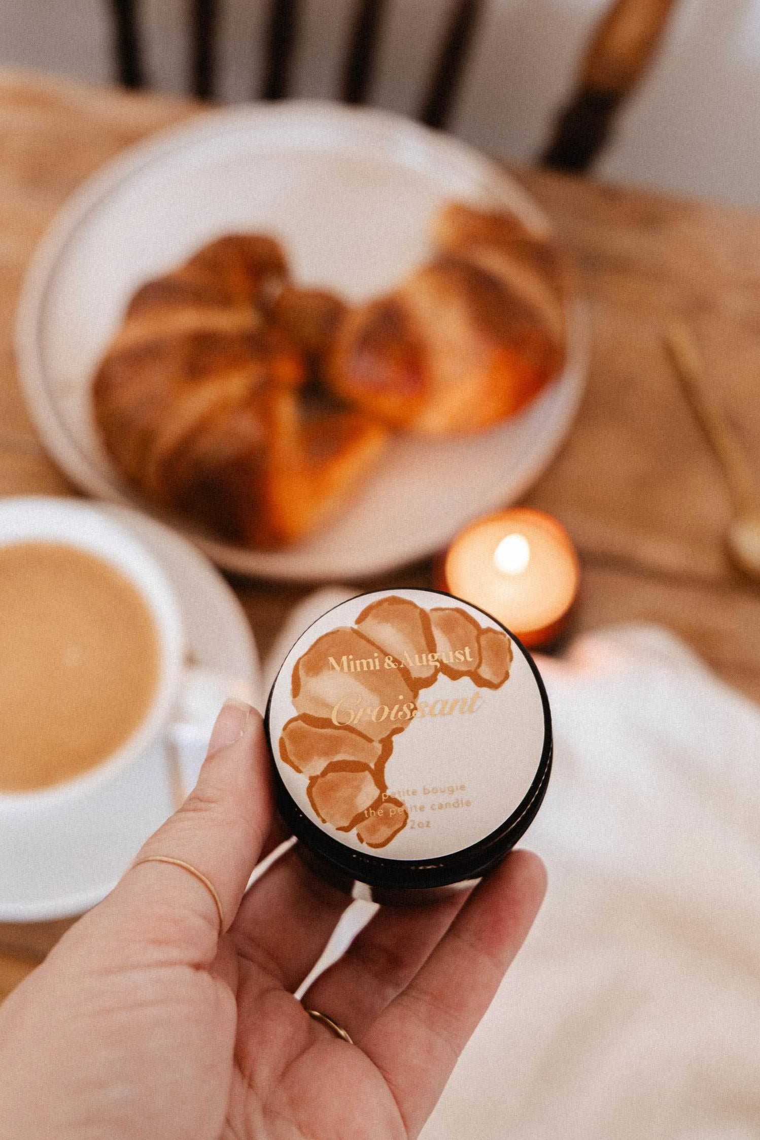 hand holding Croissant Candle at Maison garçonne