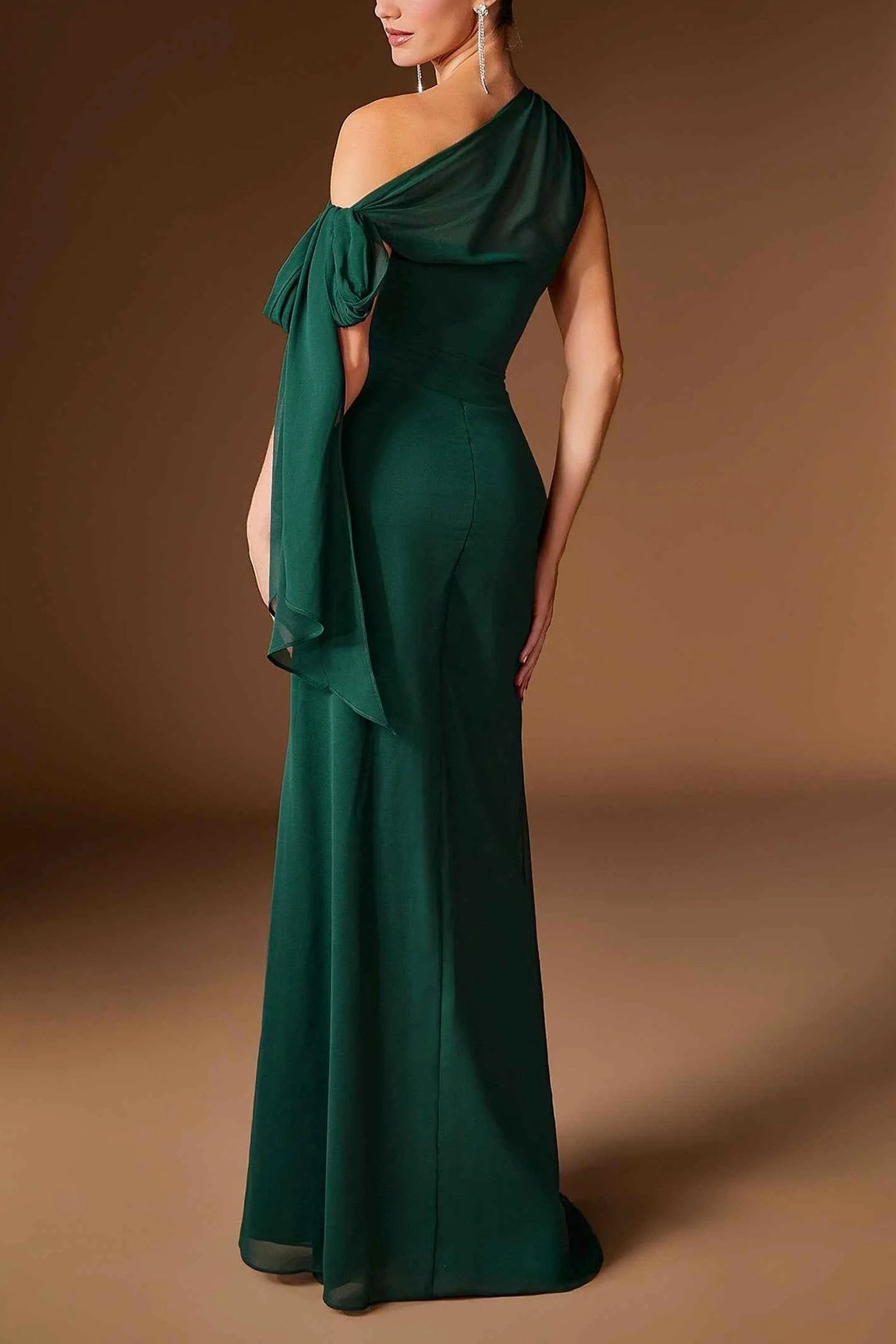 back view of a woman wearing Devica Green One-Shoulder Beaded Chiffon Maxi Dress from Boutique 1861