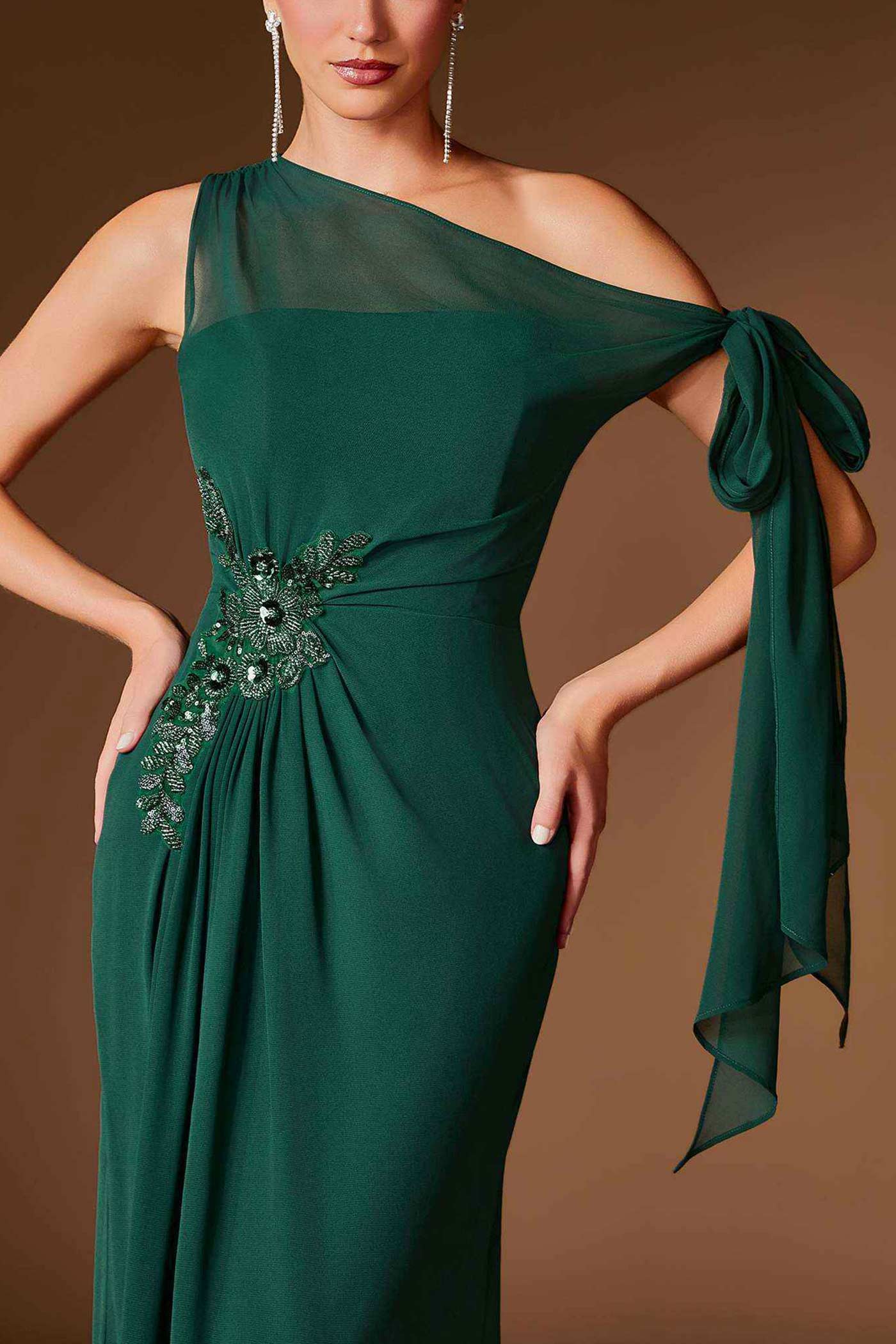 close-up of a woman wearing Devica Green One-Shoulder Beaded Chiffon Maxi Dress from Boutique 1861