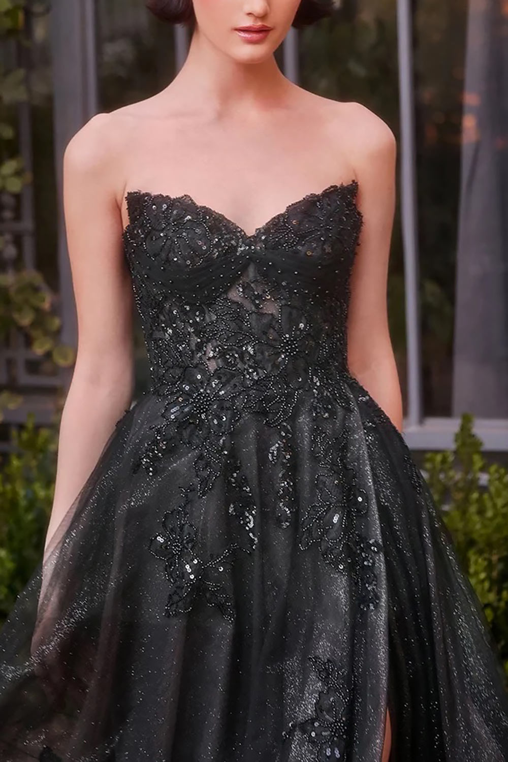 close-up of a woman wearing Dulcia Black A-Line Dress with Sequins from Boutique 1861