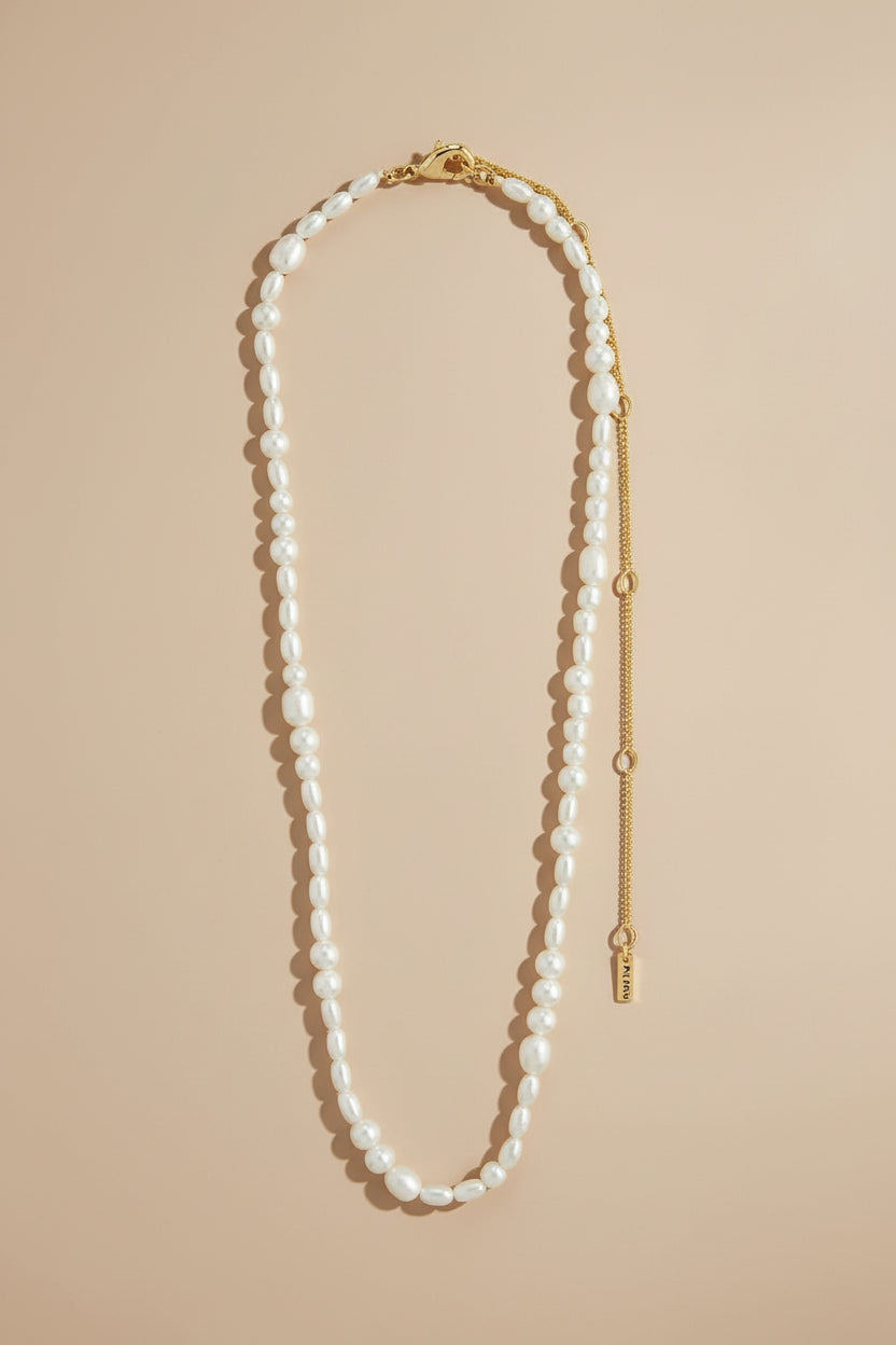 Pearl necklace ELLIANA-GOLD by Pilgrim with a gold clasp on a white background