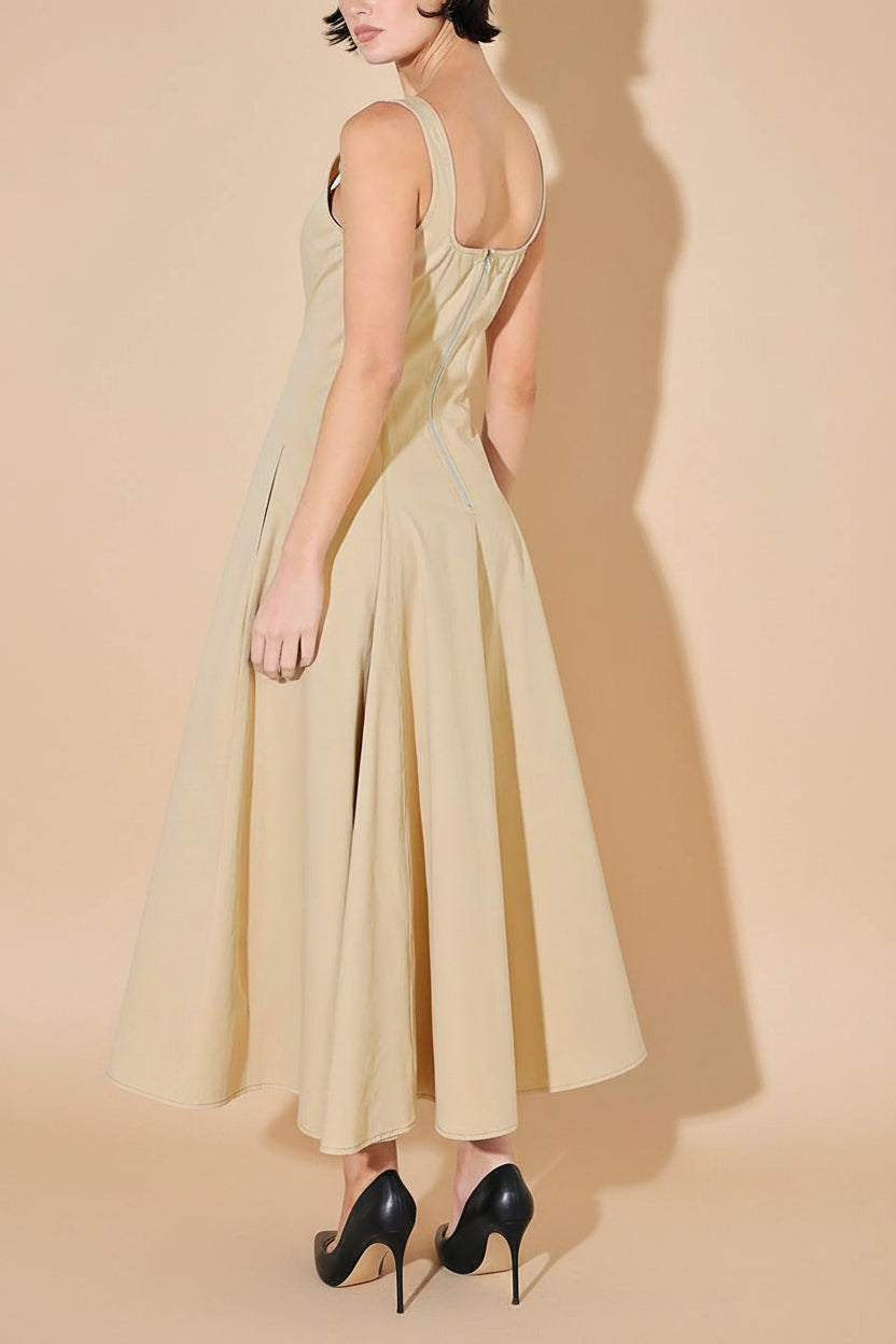 back view of a woman wearing Elynor Beige Midi Dress with Pockets from Boutique 1861