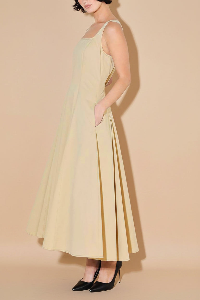 pocket view of a woman wearing Elynor Beige Midi Dress with Pockets from Boutique 1861