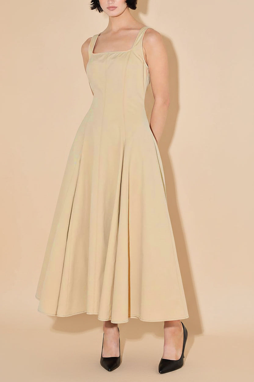 front view of a woman wearing Elynor Beige Midi Dress with Pockets from Boutique 1861
