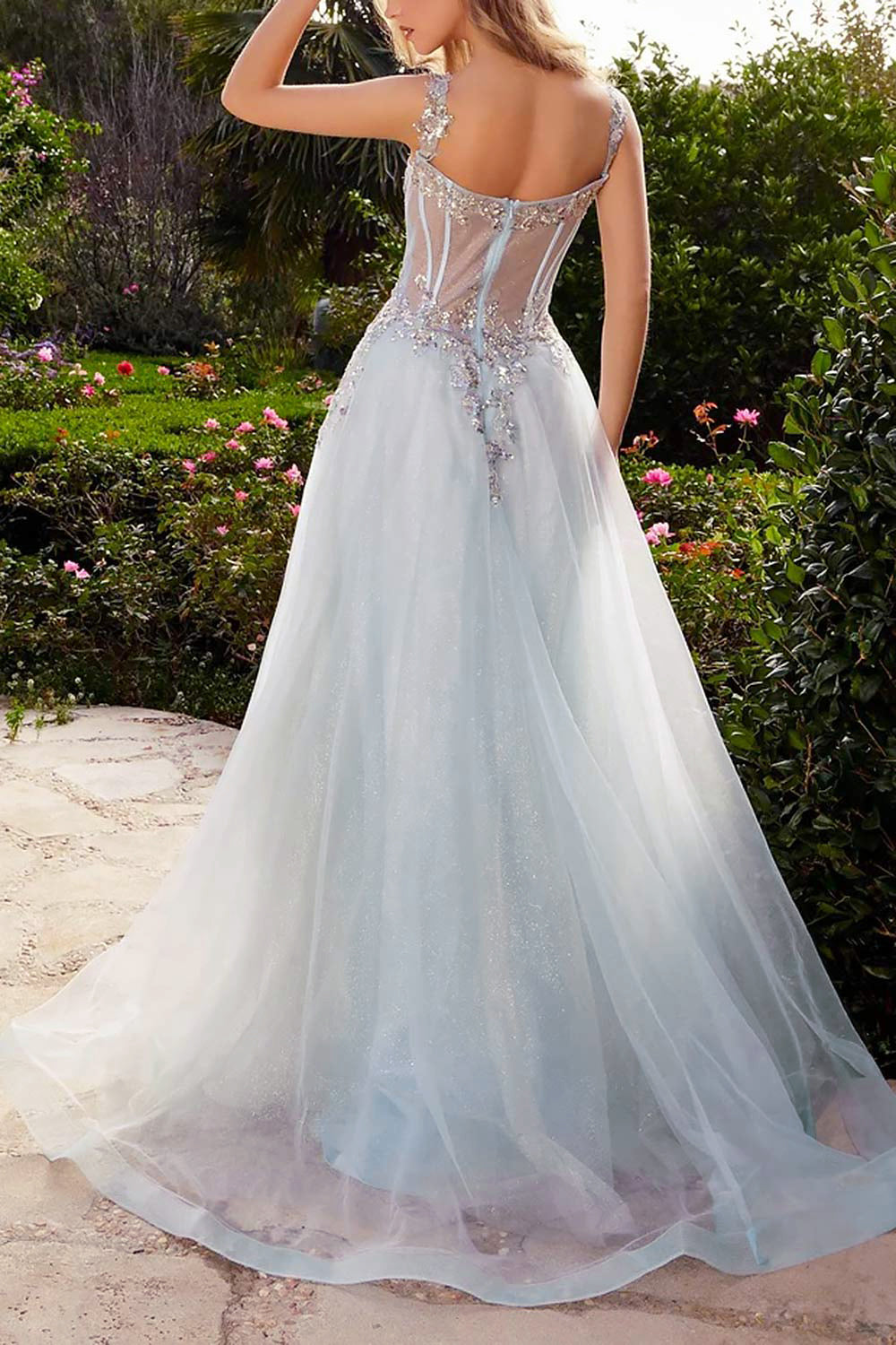 back view of a woman wearing Emerie Blue Translucent A-Line Corset Dress from Boutique 1861