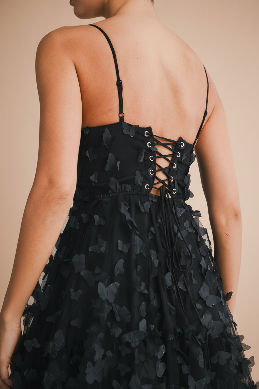 close-up of women wearing Faya Black Short Corset Dress with Butterflies From Boutique 1861