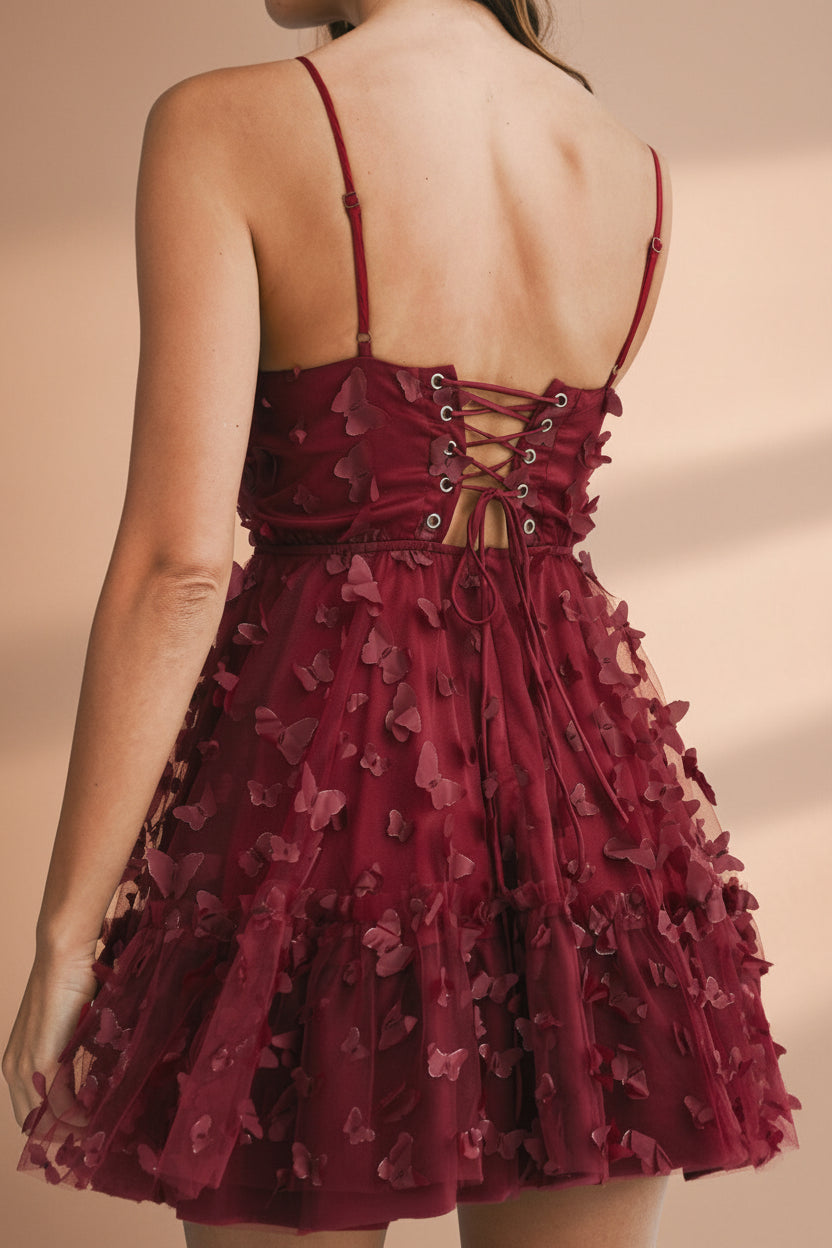 back of a women wearing Faya Burgundy Short Corset Dress with Butterflies from Boutique 1861