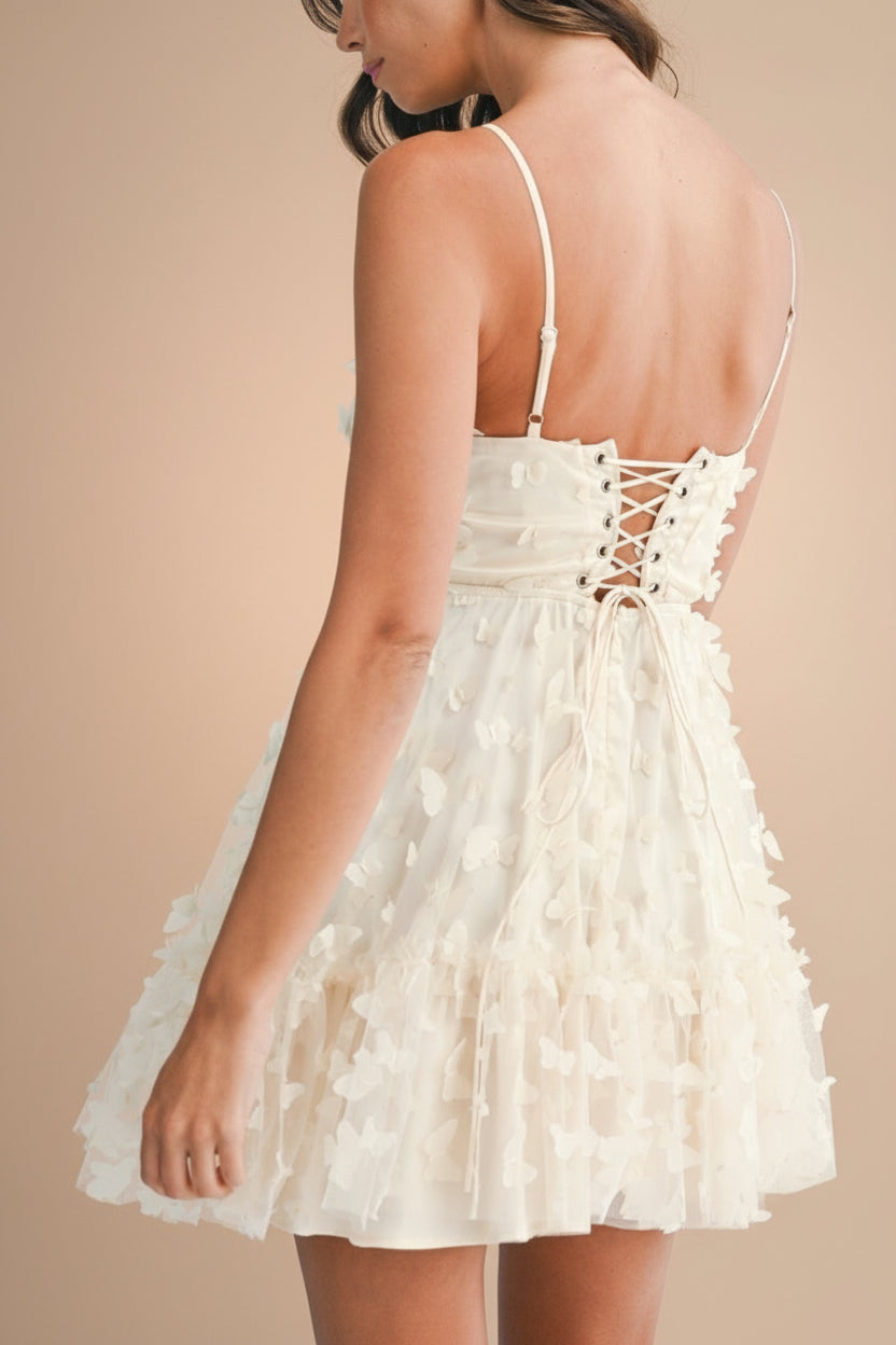 back of women wearing Faya Ivory Short Corset Dress with Butterflies From Boutique 1861