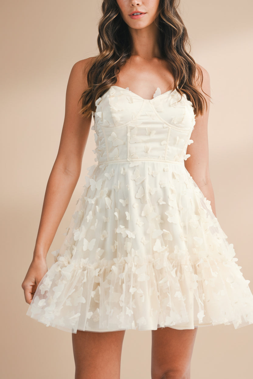 front of women wearing Faya Ivory Short Corset Dress with Butterflies From Boutique 1861