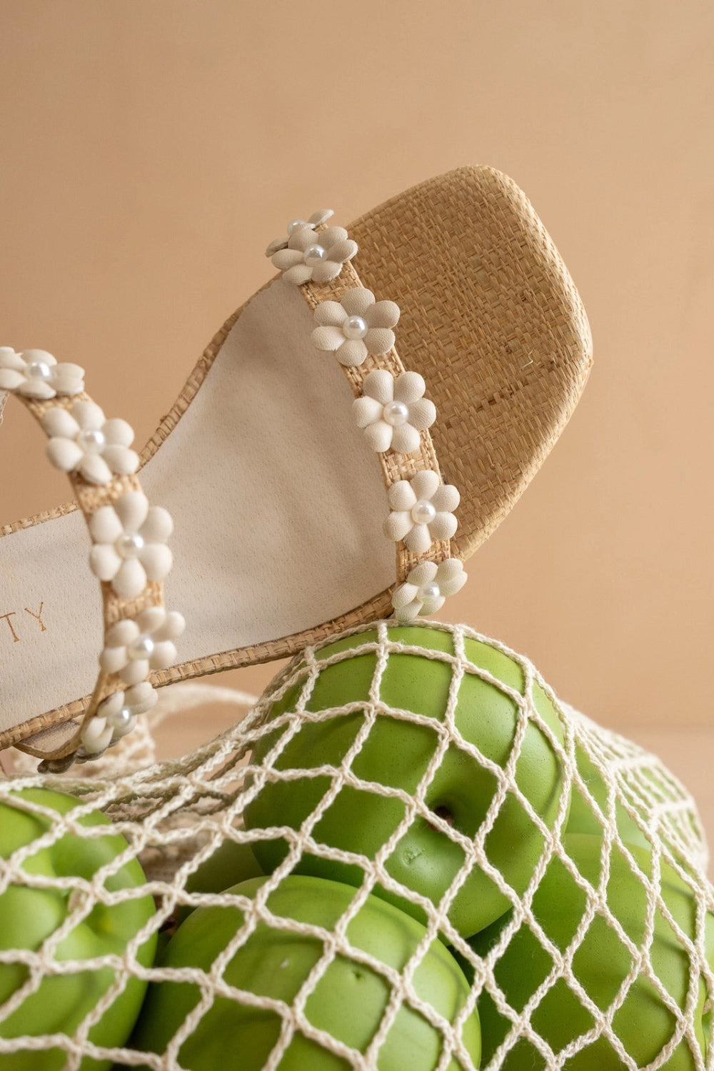 close-up of Feliza Raffia Block Heel Sandals with Floral Appliqués | La petite garçonne
