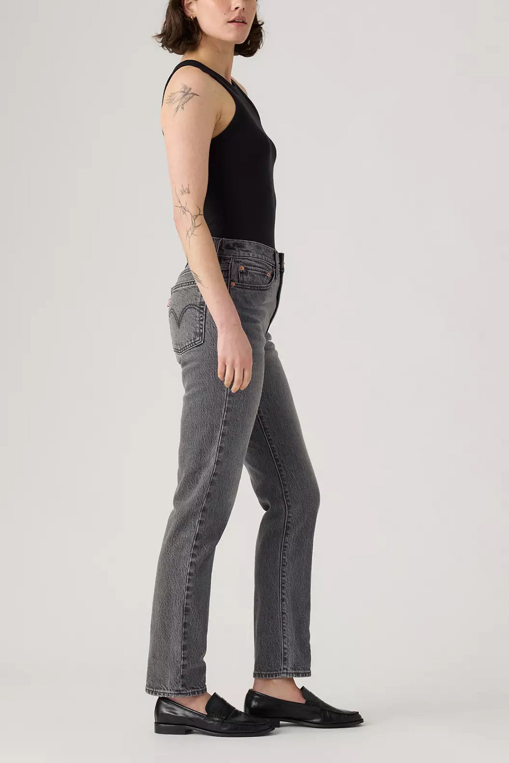 side of a woman wearing Fidenza Slim Leg Grey Denim Pants from La petite garçonne