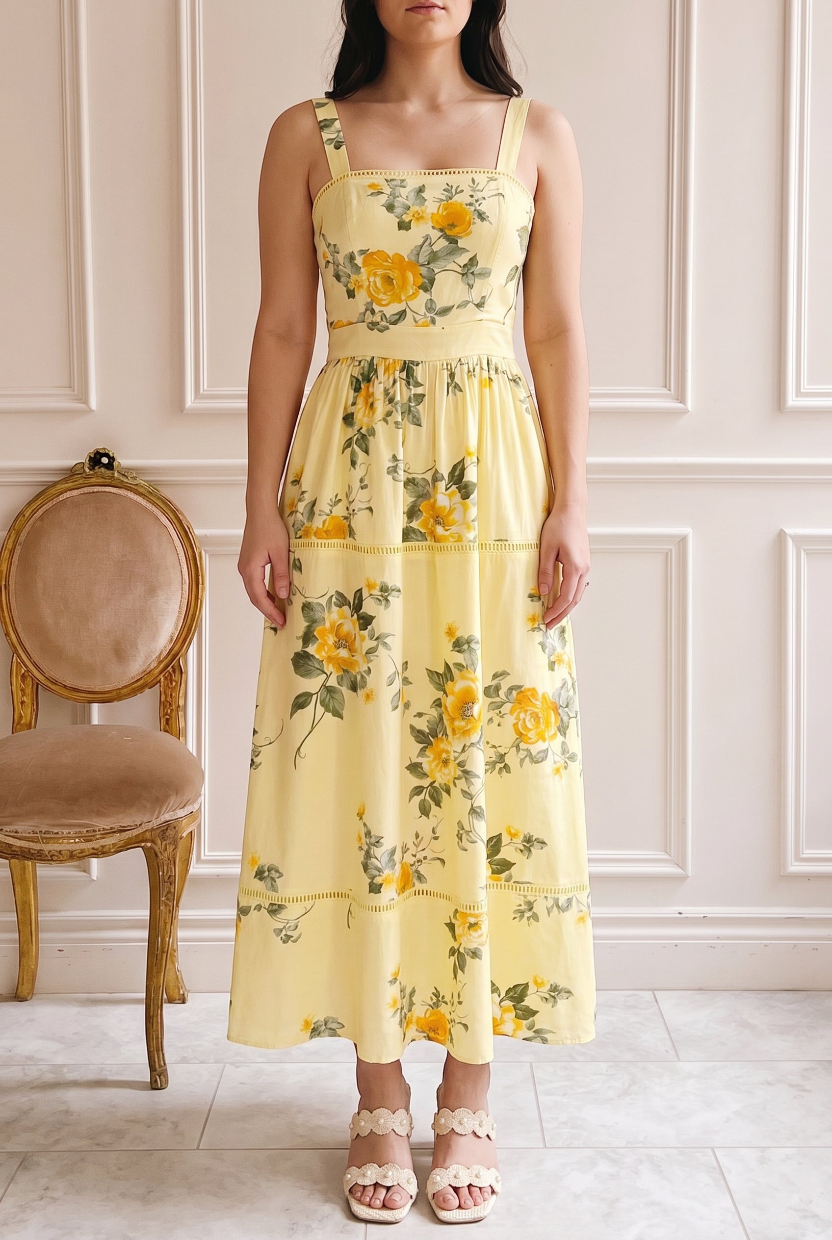 Woman wearing Najwa Yellow Midi Dress with Floral Pattern at boutique 1861