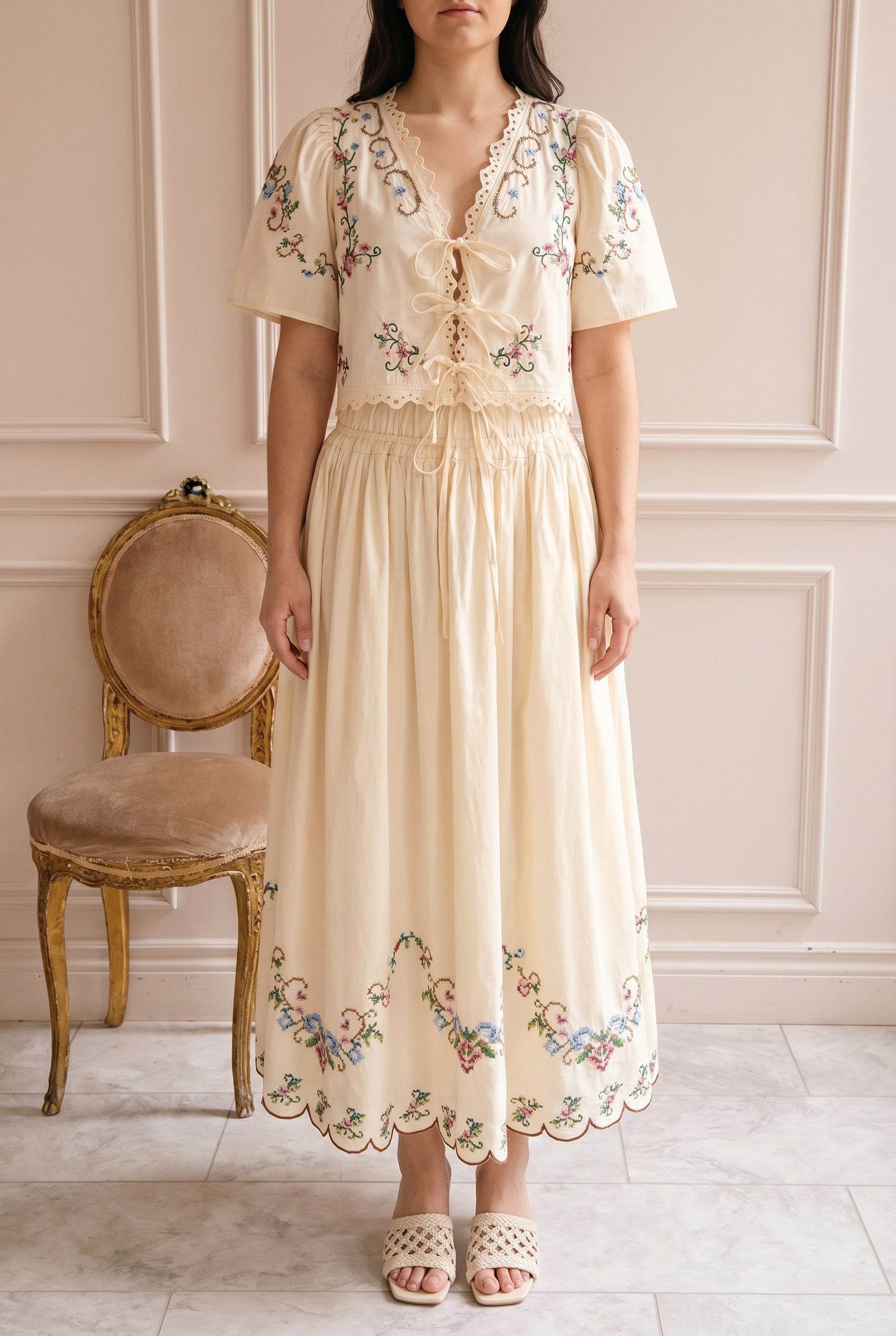 Woman wearing Glenna and Thecle Beige Embroidered Cropped Top at boutique 1861