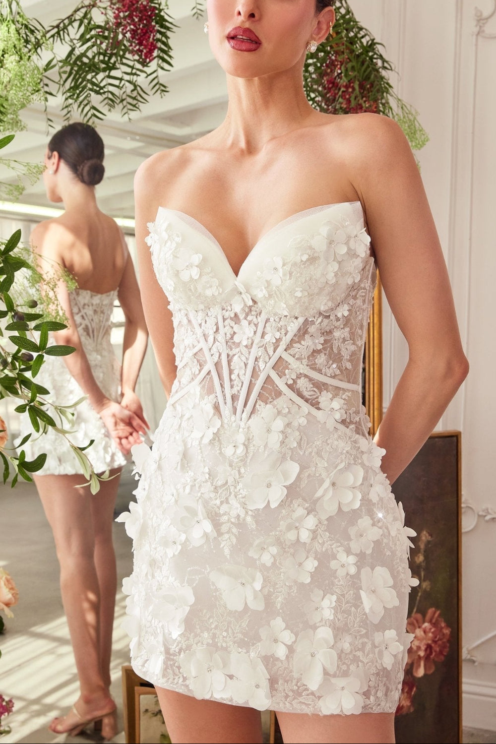 Woman wearing GWENYTH, a white floral dress with flowers and corset from Boudoir 1861