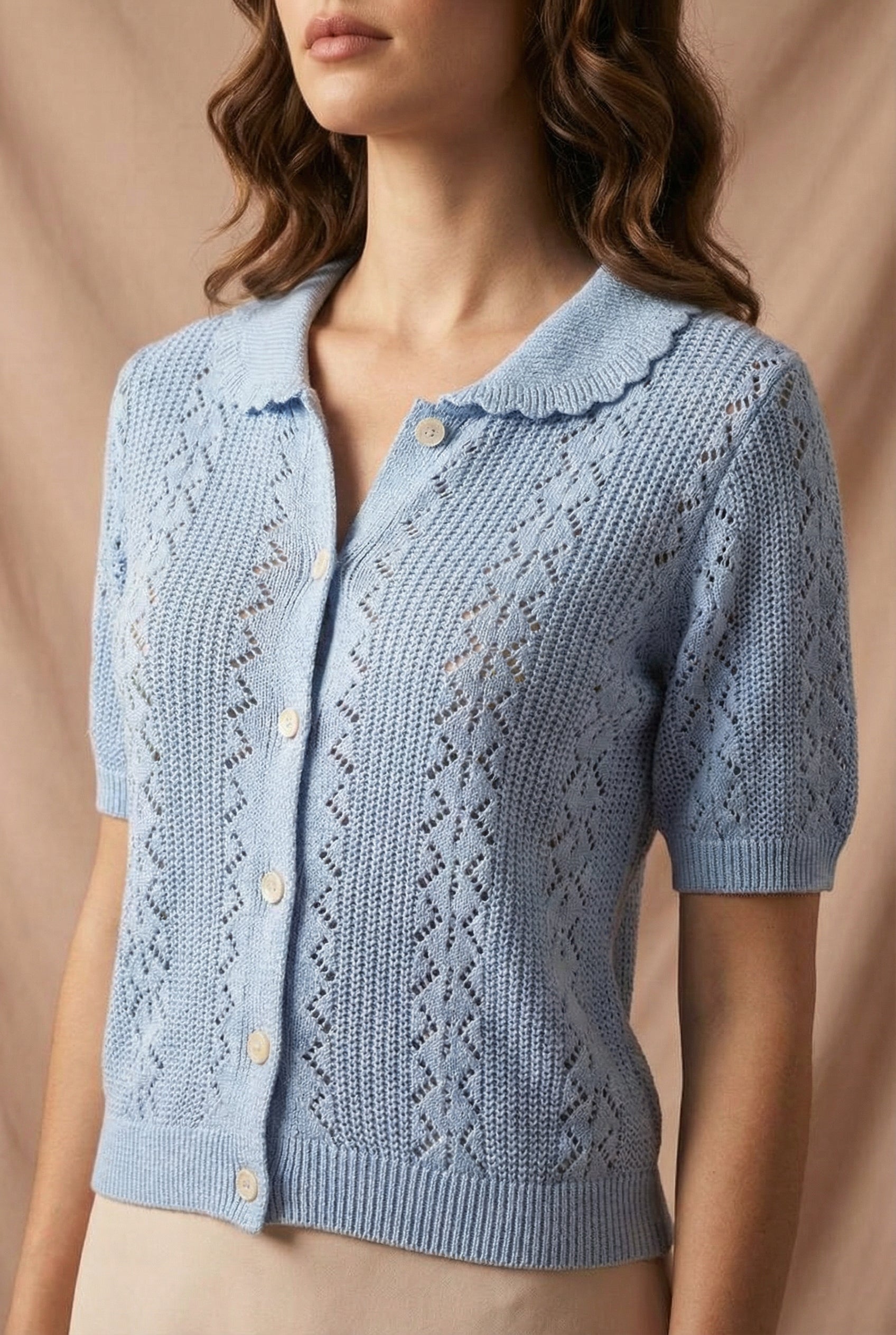 woman wearing Gertie Blue Openwork Short Sleeve Cardigan from Boutique 1861 