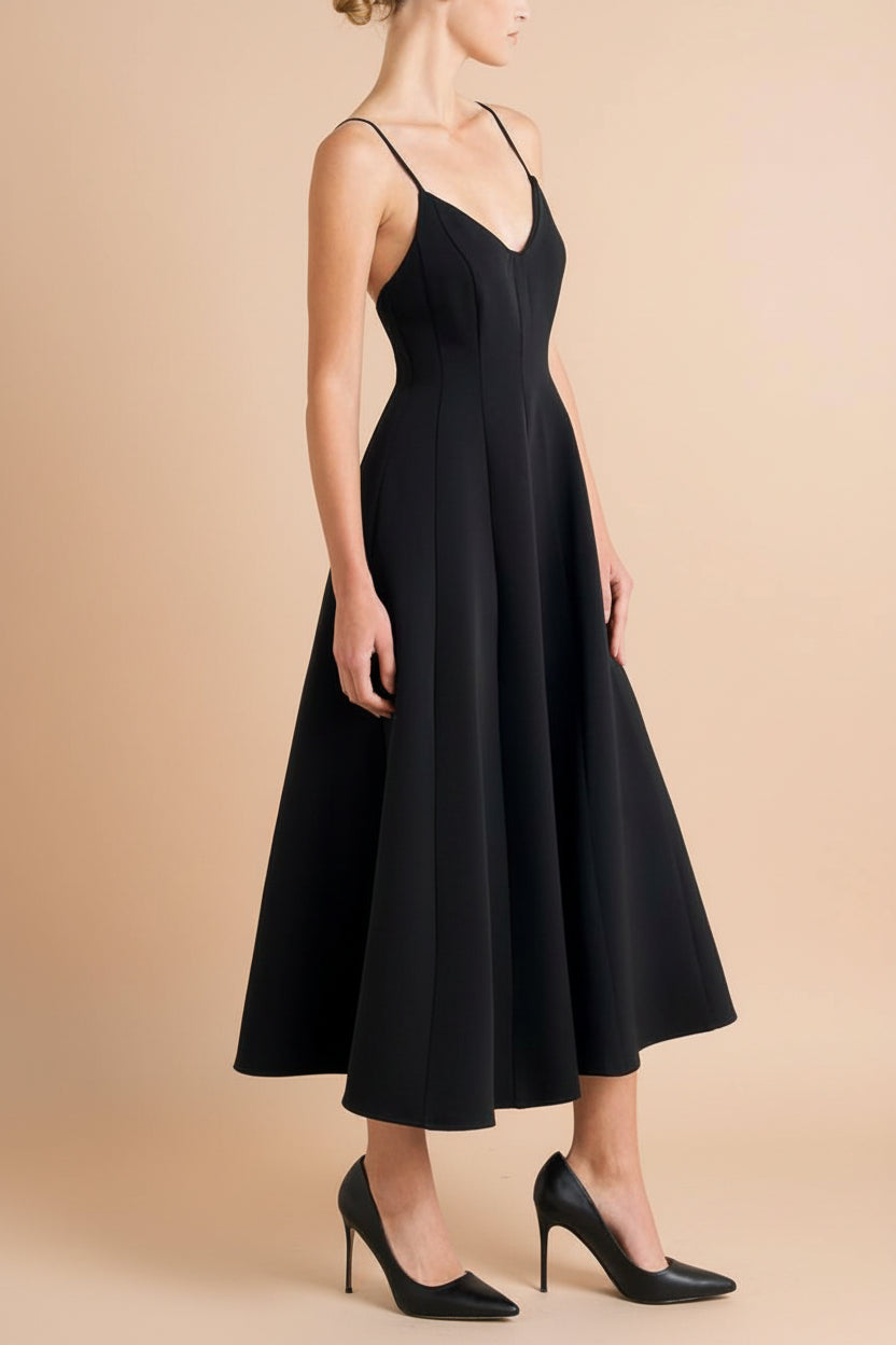 side of a woman wearing  Hariette Black A-Line Midi Dress with V-Neck from Boutique 1861