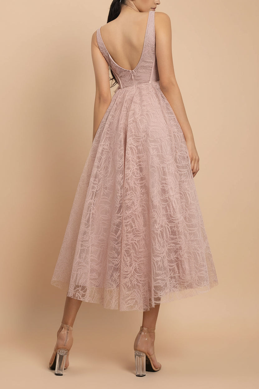 back of a woman wearing Hellis Pink Midi Dress with 3D Flower from Boutique 1861