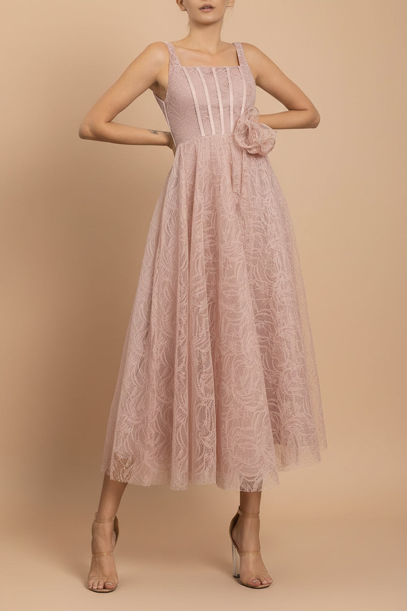 front of a woman wearing Hellis Pink Midi Dress with 3D Flower from Boutique 1861