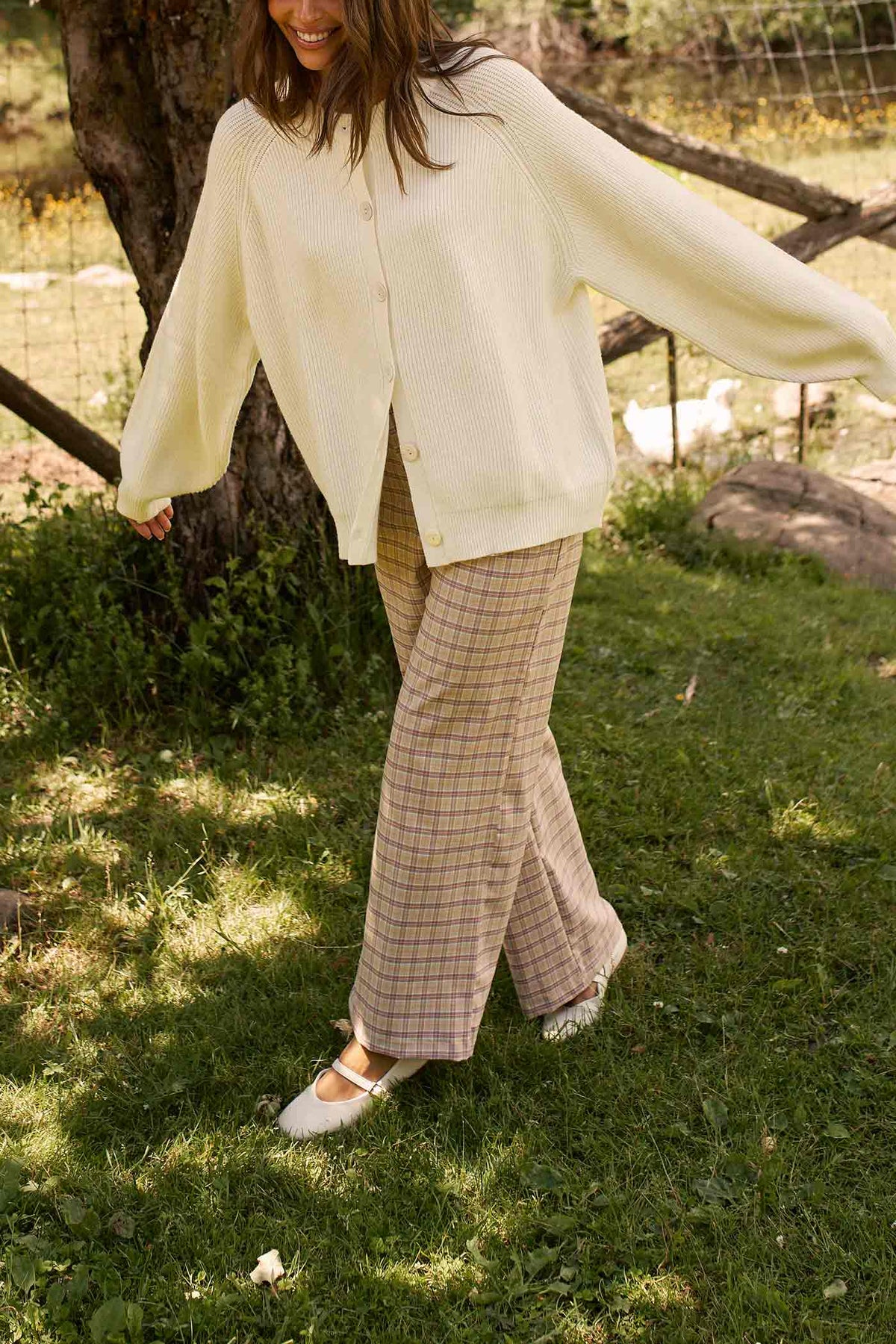 front view of a woman wearing Harper Pants Beige High-Waisted Plaid Straight Pants by Dailystory from La petite garçonne
