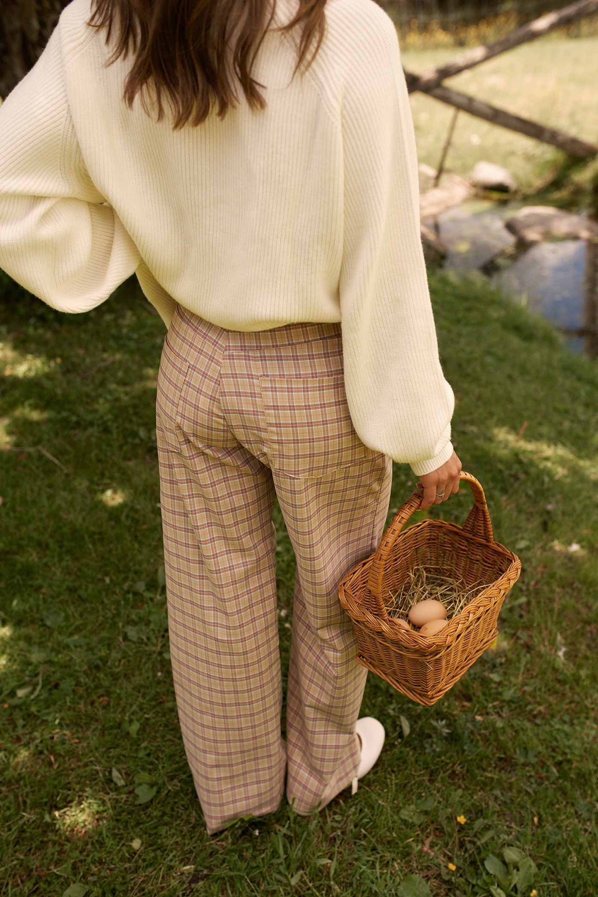 back view of a woman wearing Harper Pants Beige High-Waisted Plaid Straight Pants by Dailystory from La petite garçonne